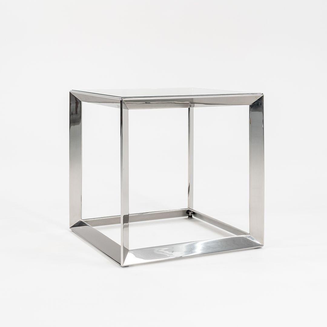 This is a large Russian Doll table in solid polished stainless steel, produced by Gratz Industries for Dennis Miller, designed by Rockwell Group, the world-renowned design firm. This is the largest of three sizes. Three tables are available in this