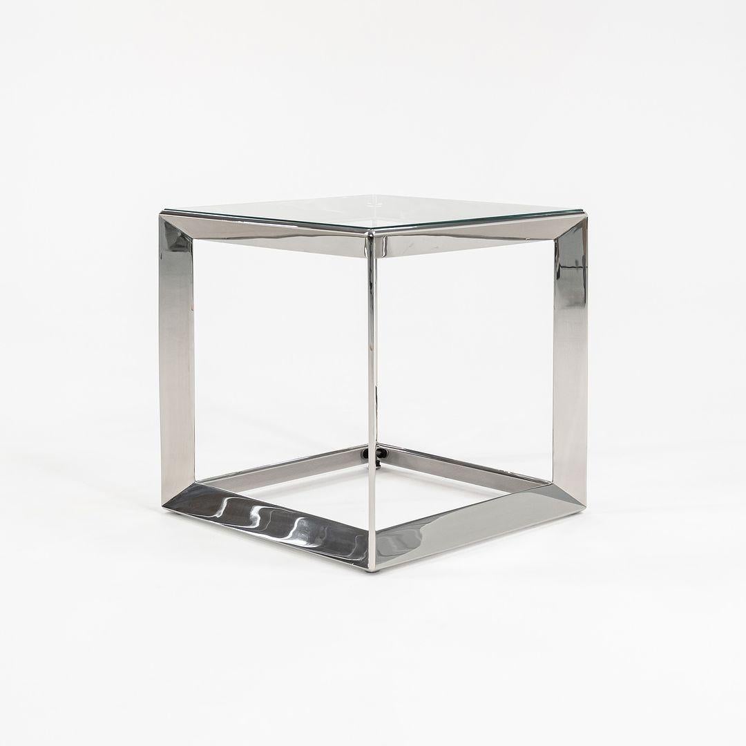 This is a medium-size Russian Doll table in solid polished stainless steel, produced by Gratz Industries for Dennis Miller, designed by Rockwell Group, the world-renowned design firm. This is the middle of three sizes. Three tables are available in