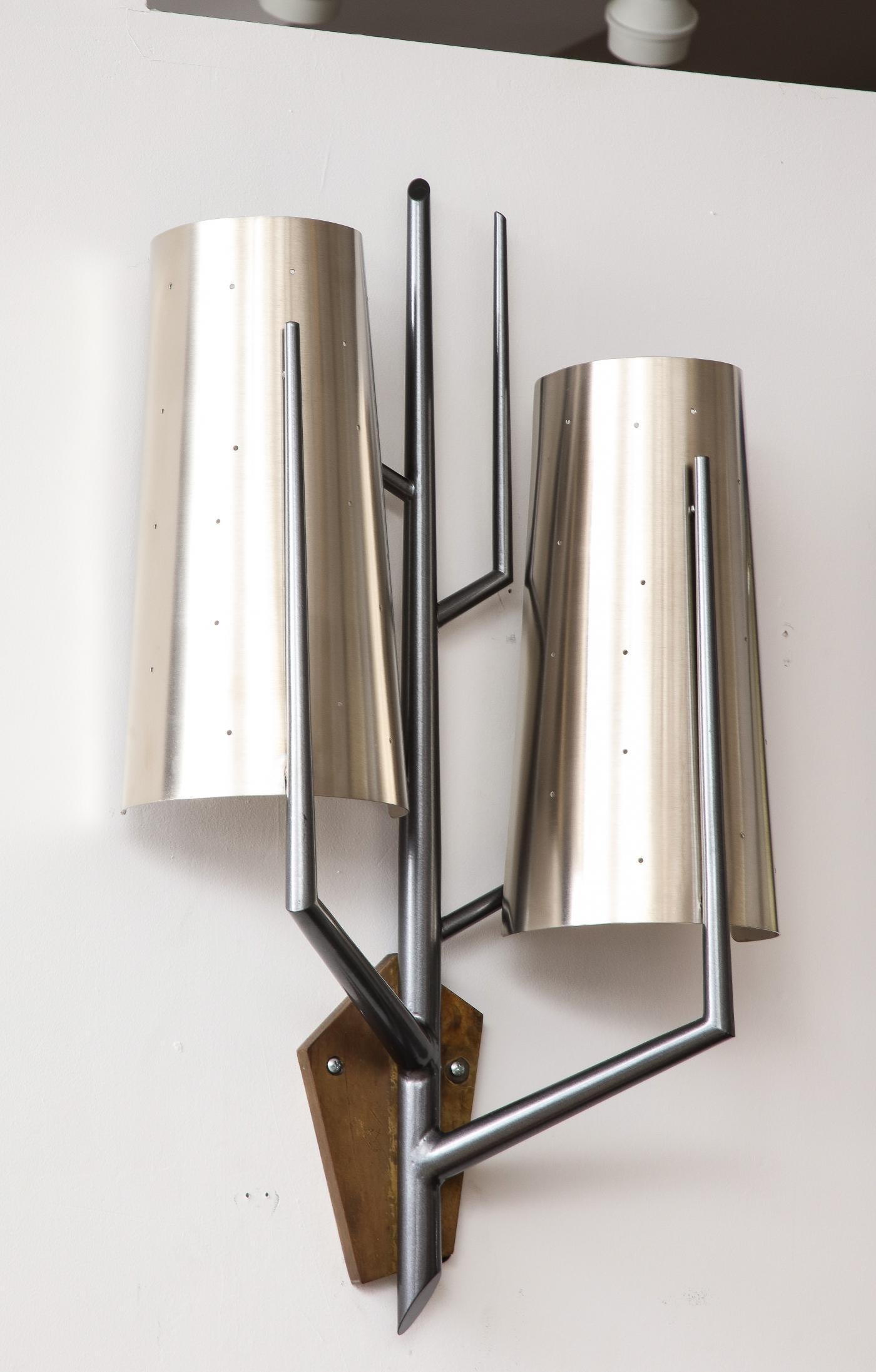 Stainless Steel Sconce in the Manner of Maison Charles, France

These monumental wall sconces are graphic and feature a beautiful contrast between polished and darkened steel.

