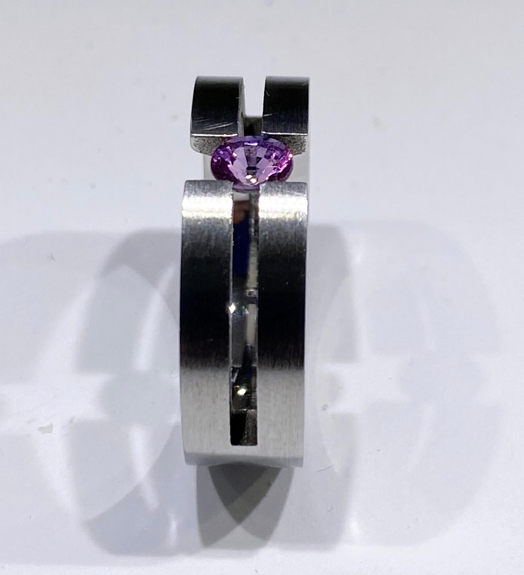 Oval Cut Stainless Steel Tension Ring set with a Purple Sapphire  For Sale