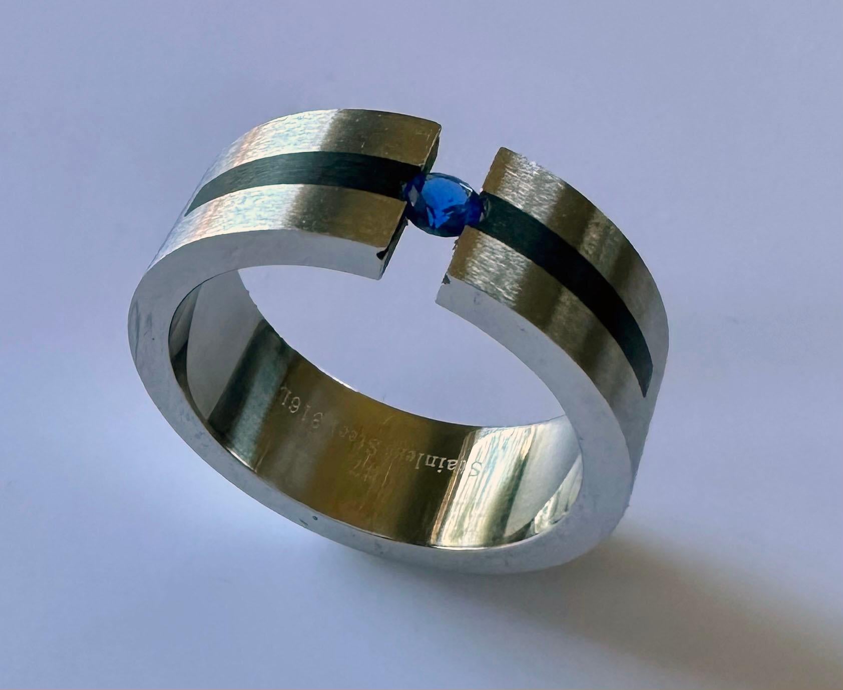 Round Cut Stainless Steel Tension Ring set with Sapphire For Sale