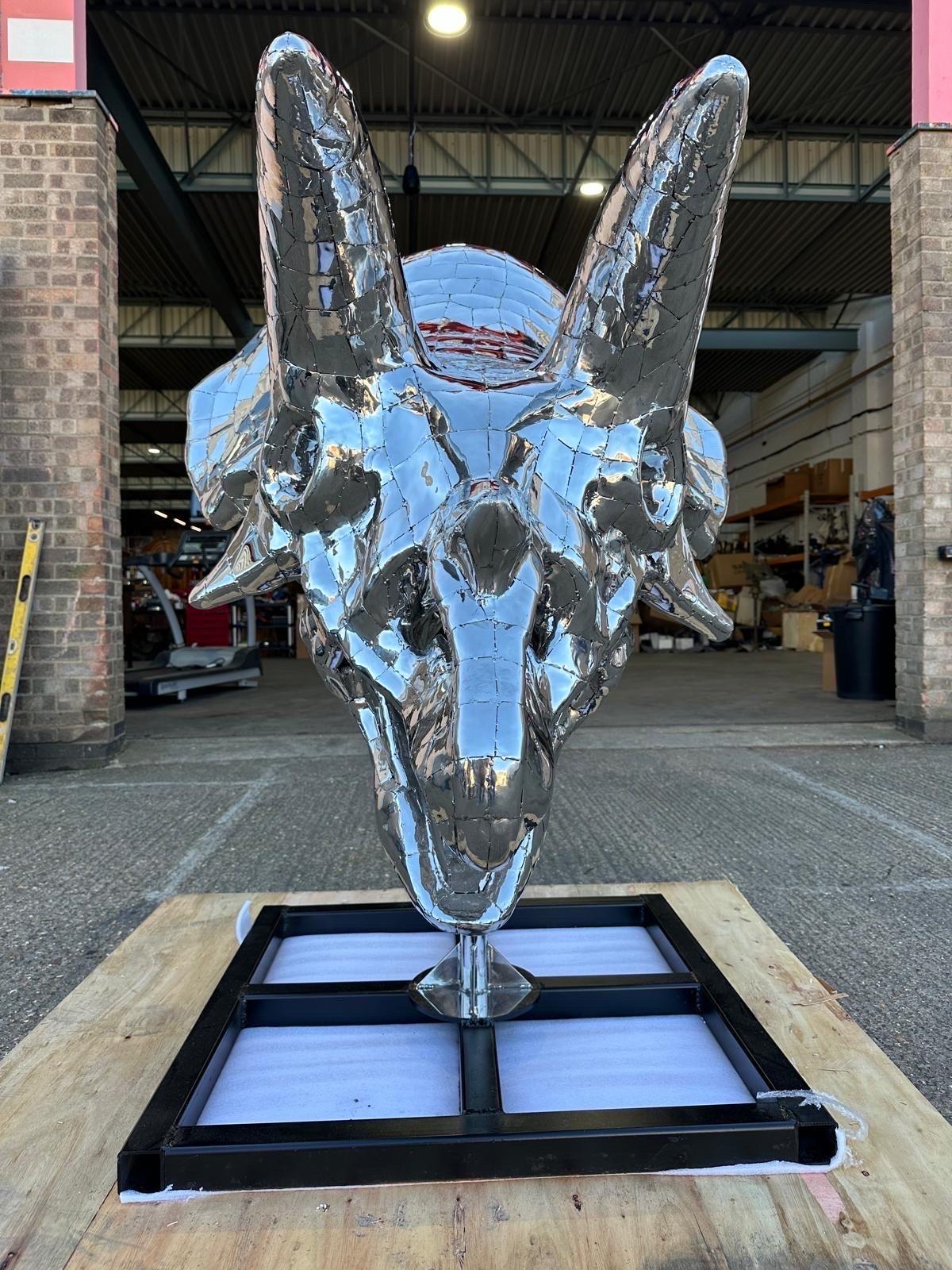 This striking stainless steel Triceratops sculpture is a stunning representation of prehistoric power and elegance. Expertly crafted, it showcases intricate details that bring the iconic dinosaur to life, from its distinctive frill to its formidable