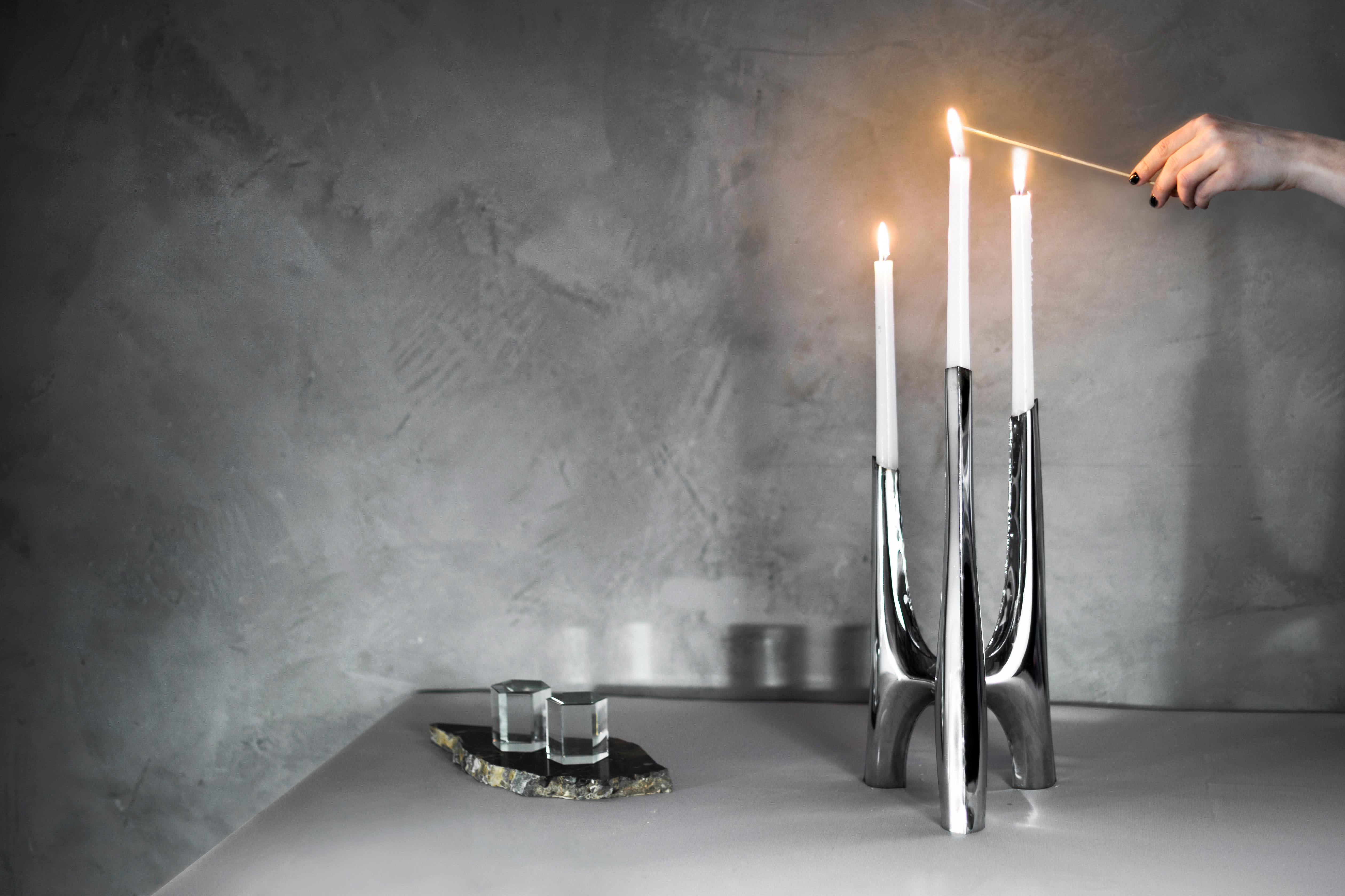 Usually made of metal, the modern candle holders are available in myriad shapes and styles. From simple, minimalist ones to opulent, eclectic candelabra. Triglav, a steel candle holder from Zieta Studio, is a candelabrum with three arms of unusual