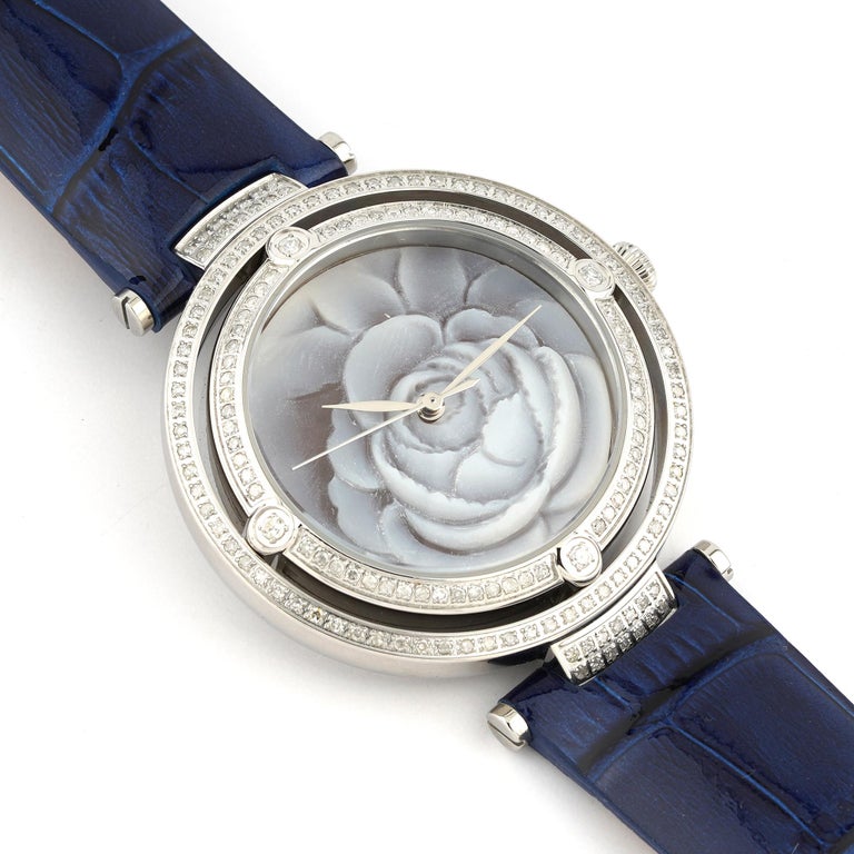 Stainless steel  Watch with Sea Shell Cameos PVD treated with 27 mm Sea Shell Cameos and 0,88ct diamonds.  Fully handcarved Peony on a sea shell cameo set on  Stainless steel Pendant  Watch with PVD treated and diamonds. Watch strap is made from Bos