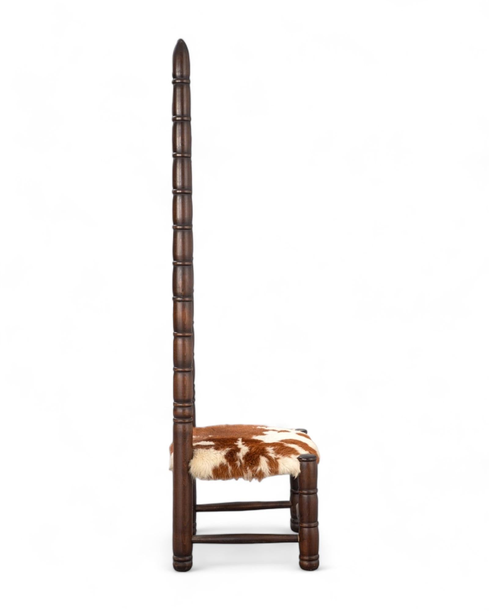 Vintage stair chair from the 1960s. Dark glazed wood construction, with high back and animal skin seat, probably goatskin.