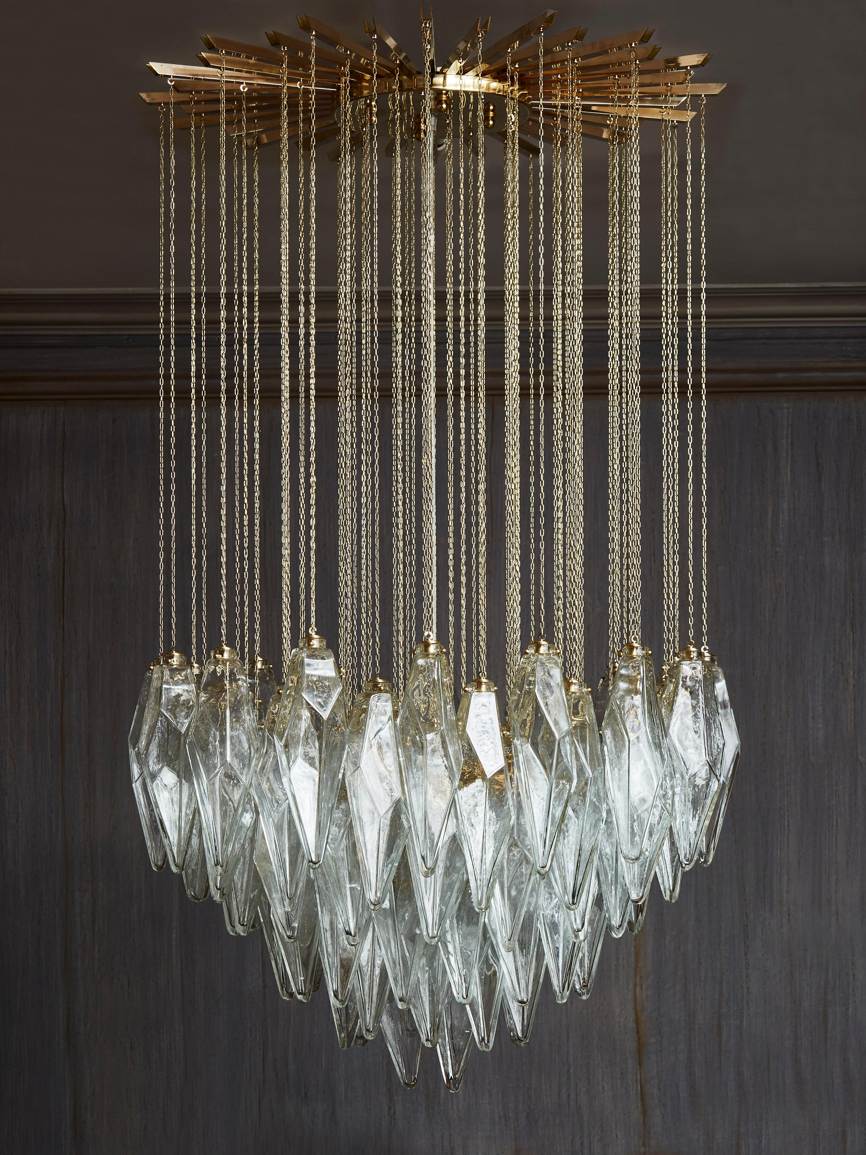 Exceptional chandelier in brass with falling blown and sculpted Murano glass 