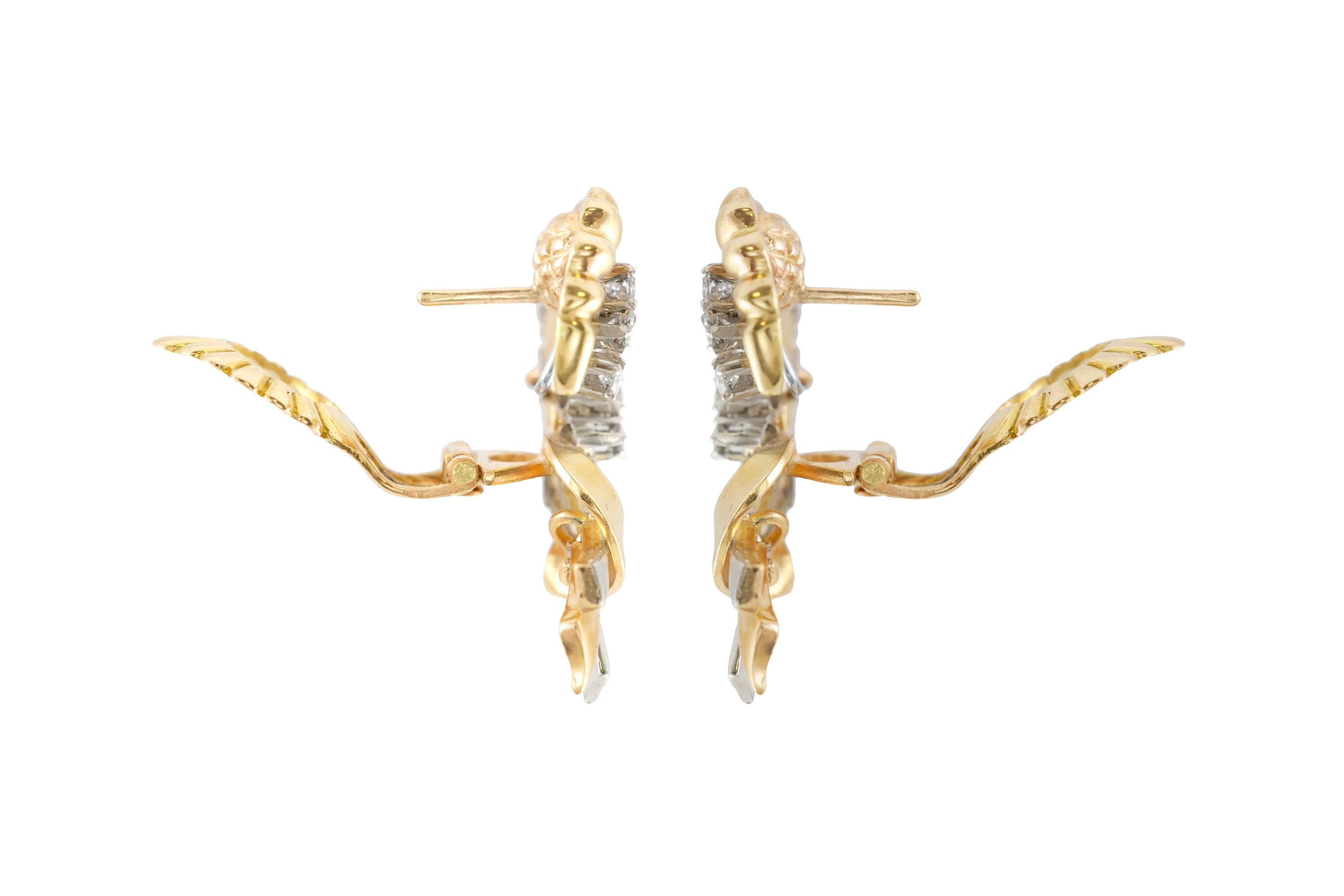 The earrings are finely crafted in 18k yellow gold and platinum with round cut diamonds weighing a total of approximately 1.50 carat. 
Circa 1940.