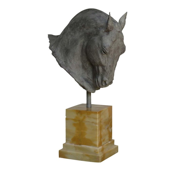 This stunning sculpture depicts the magnificent head of a stallion, as it elegantly lowers it. It was modelled in 2018 by Vincenzo Romanelli in clay from life of a renowned Dutch competition stallion. From the clay model, a silicon mould was taken
