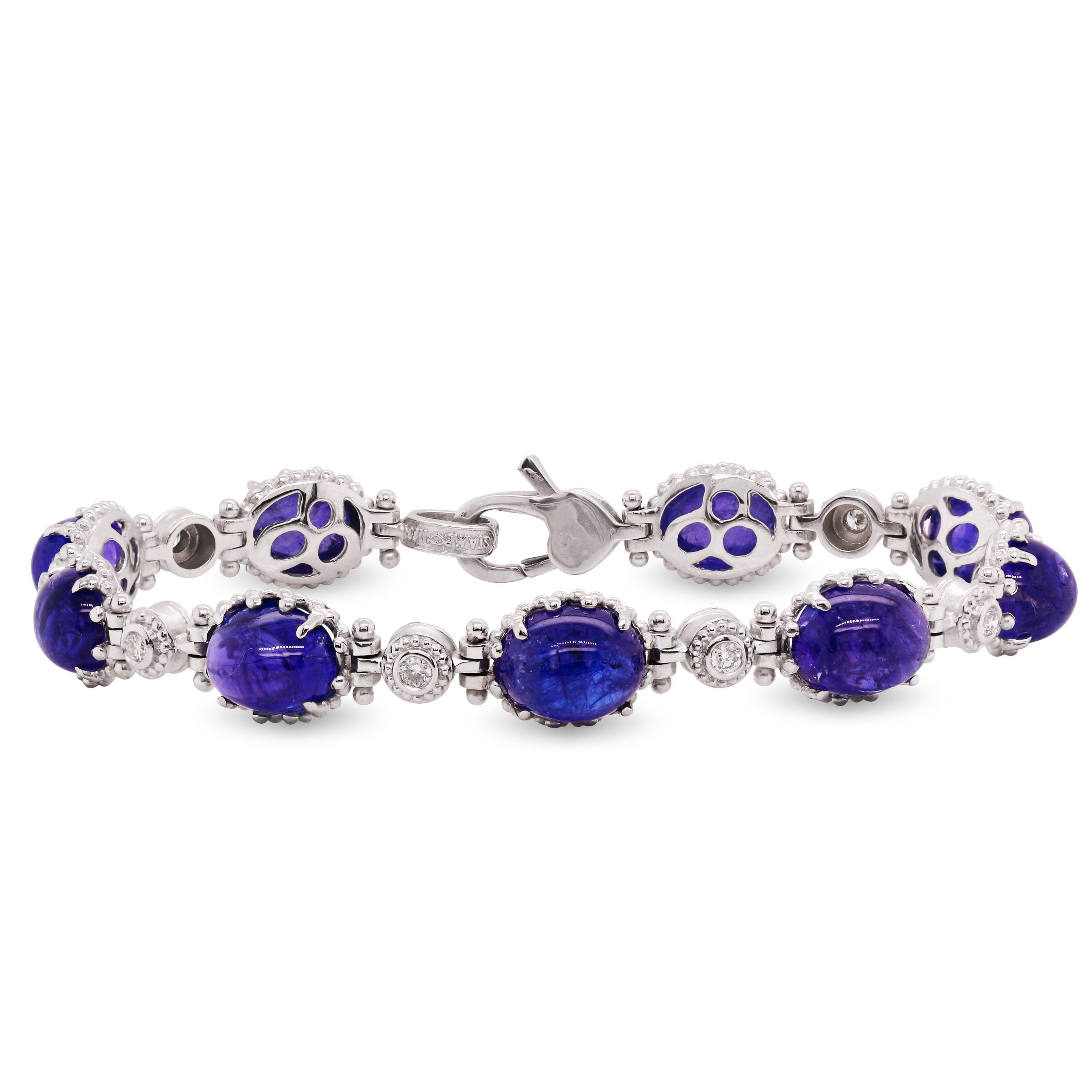 Stambolian 18 Karat White Gold Diamond Cabochon Oval Tanzanite Bracelet

This fun and everyday bracelet is made in solid 18k white gold and features nine cabochon-cut, oval Tanzanites with bezel set diamonds between each section.

Apprx. 28.87 carat