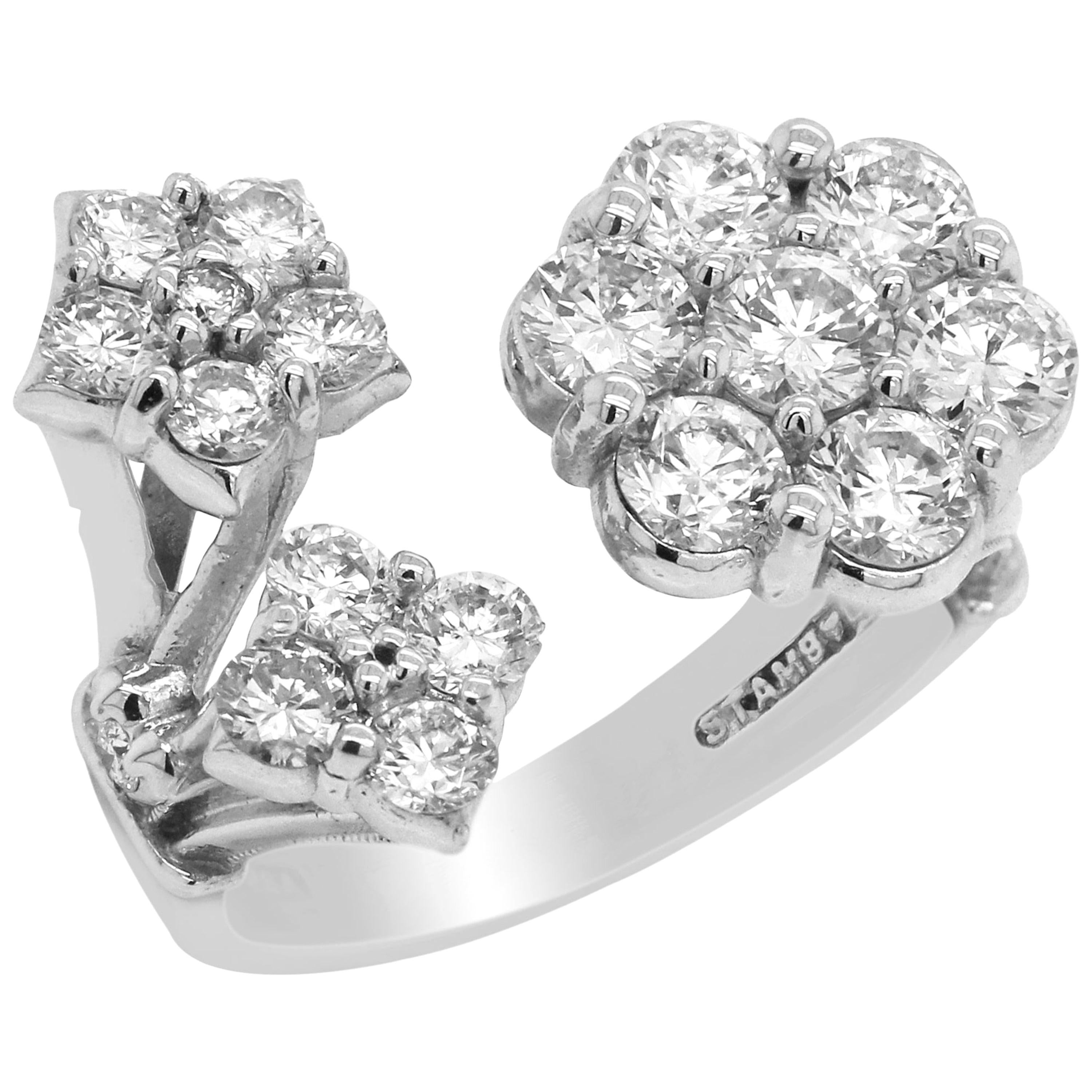 Stambolian 18K White Gold Diamond Cluster Floral Design Ring

2.17 carat G color, VS Clarity white diamonds

Face of the ring from left to right is 0.85 inch length. 0.75 inch width.

Size 6.5. Sizable by request.

Signed Stambolian and has the