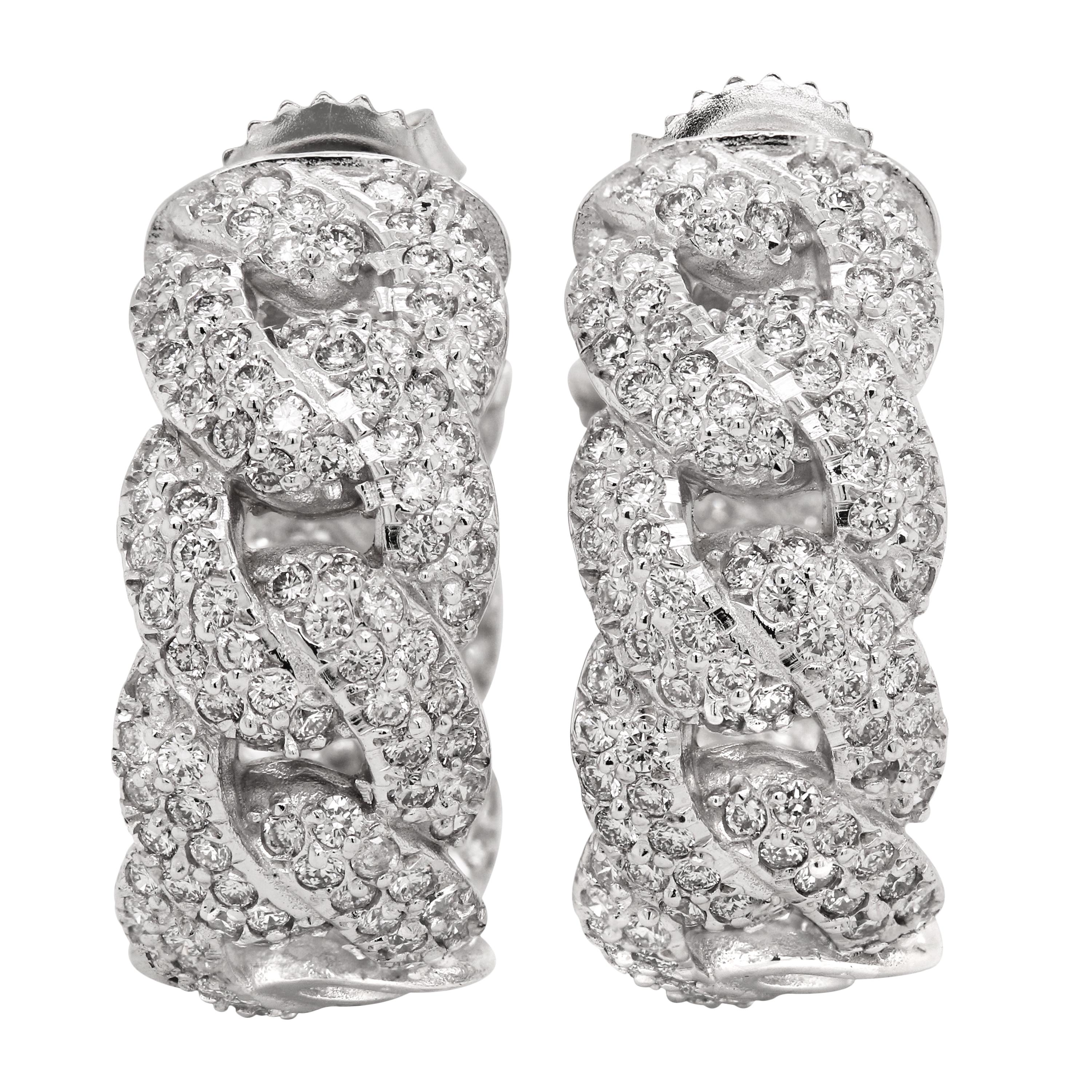 Stambolian 18 Karat White Gold Diamond Cuban Link Inside Out Hoop Earrings

This gorgeous pair of earrings by Stambolian features a cuban link design with diamonds set inside and out.

3.01 carat G color, VS clarity diamonds total weight

Earrings