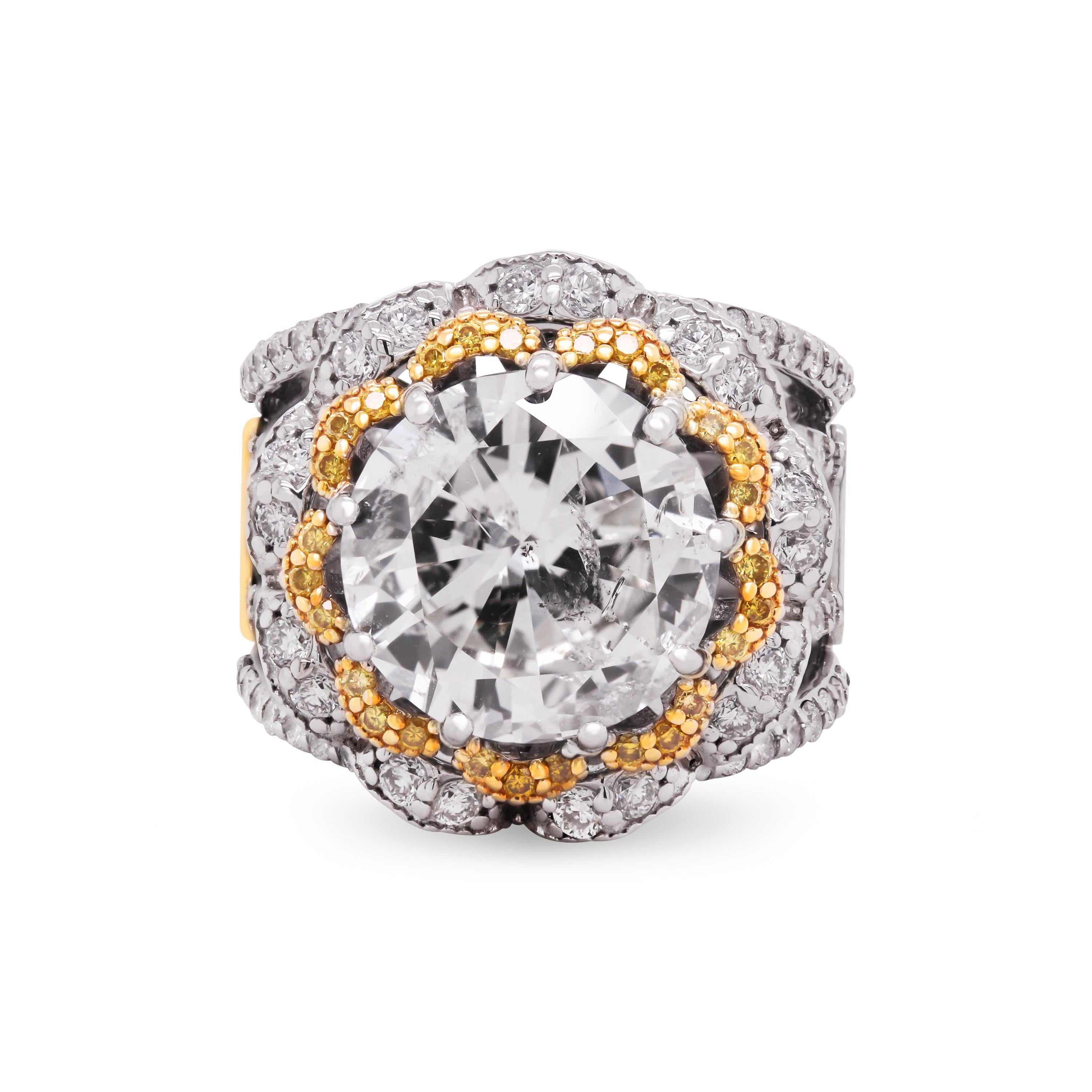 Stambolian 18K Gold 5.97 Carat Round Diamond Yellow Diamonds Four Band Ring

This one-of-a-kind masterpiece ring by Stambolian features a 5.97 carat K color, I clarity diamond center along with fancy yellow diamonds surrounding the center along with