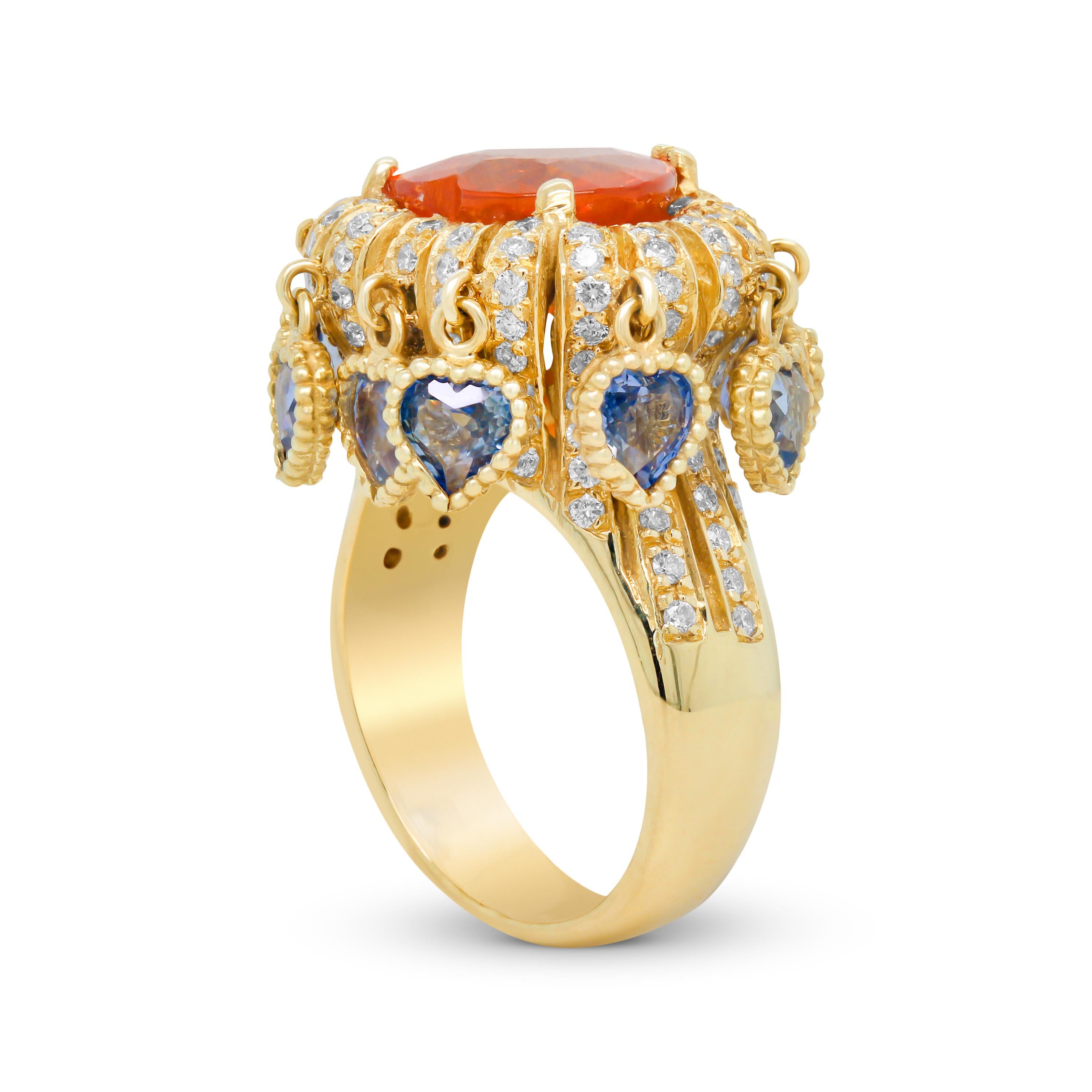 Stambolian Ring aus 18 Karat Gold mit herzförmigem Spessartit, Granat, blauen Saphiren und Saphiren in Herzform

Dieser einzigartige Ring zeigt einen herzförmigen Spessartit-Granat mit zehn baumelnden blauen Saphiren in Herzform und Diamanten. Der