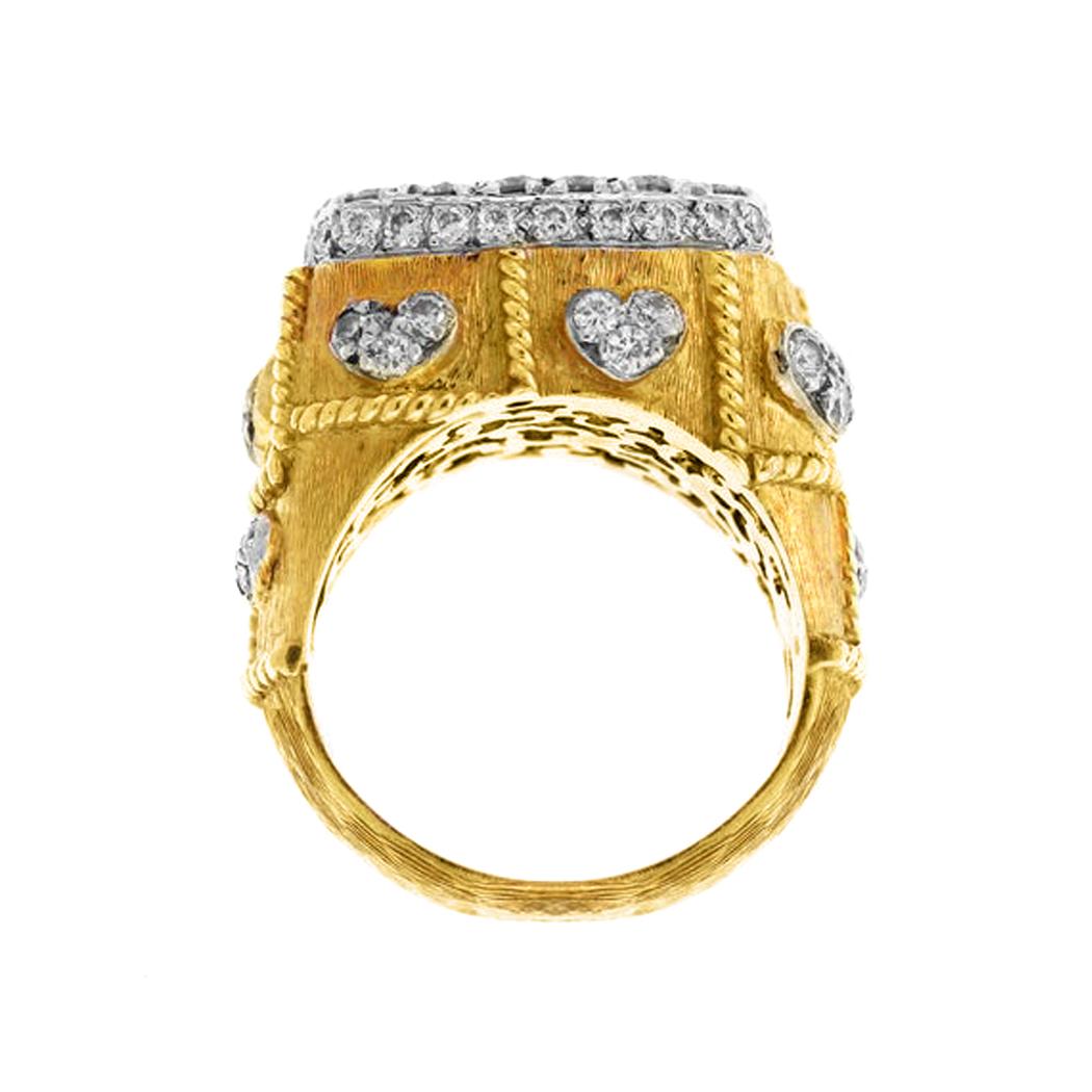 Stambolian 18K Two Tone Gold and Diamond Ring with Hearts

1.85 carat G color, VS clarity white diamonds are pavé set in the center along with the hearts all throughout the ring

This ring is a classic from the Stambolian collection

Ring face is