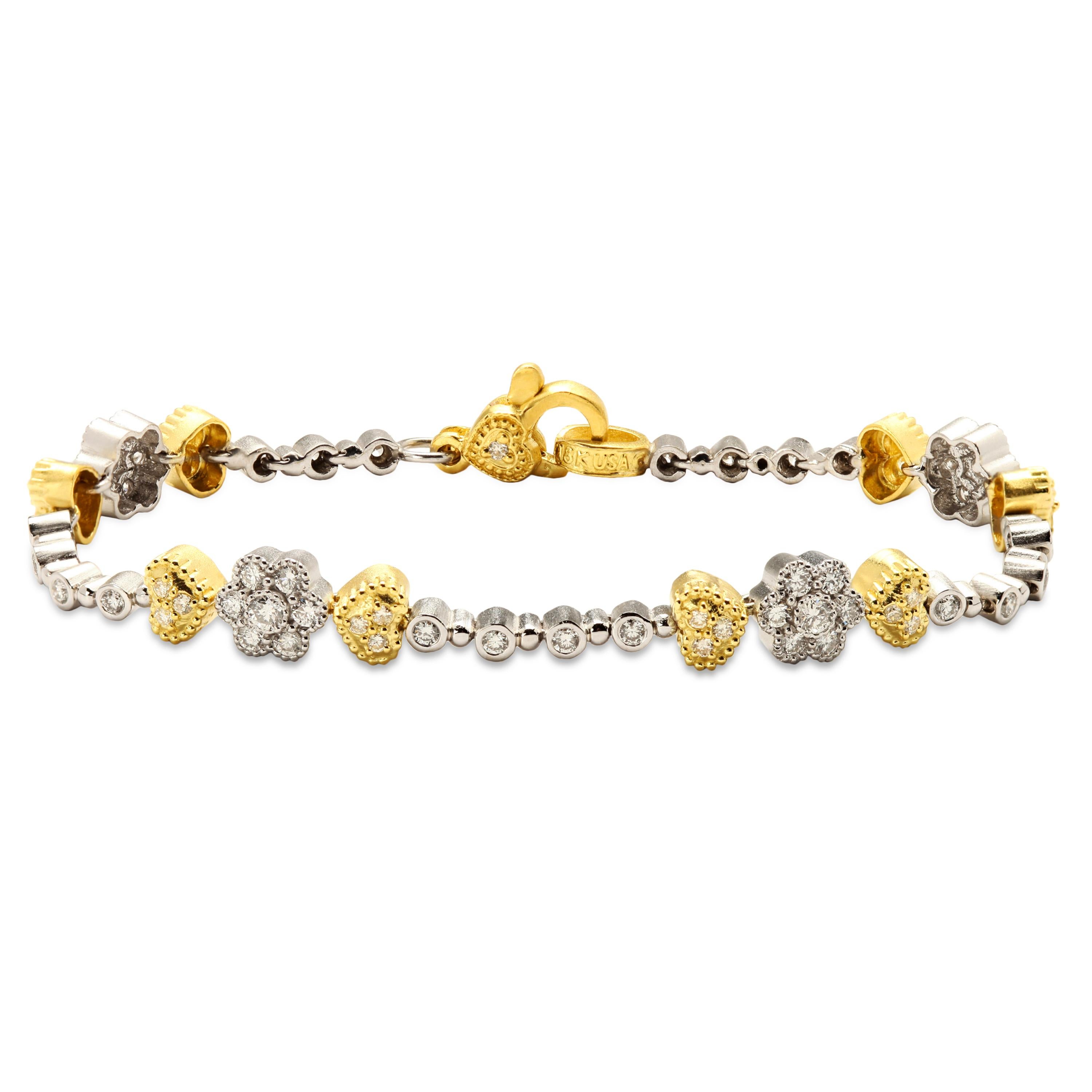 Stambolian 18K Two-Tone Yellow White Gold Diamond Tennis Bracelet

Crafted in solid 18k gold, this tennis bracelet features white gold and diamond clusters with two yellow gold and diamond hearts on each side.

1.44 carat G color, VS clarity