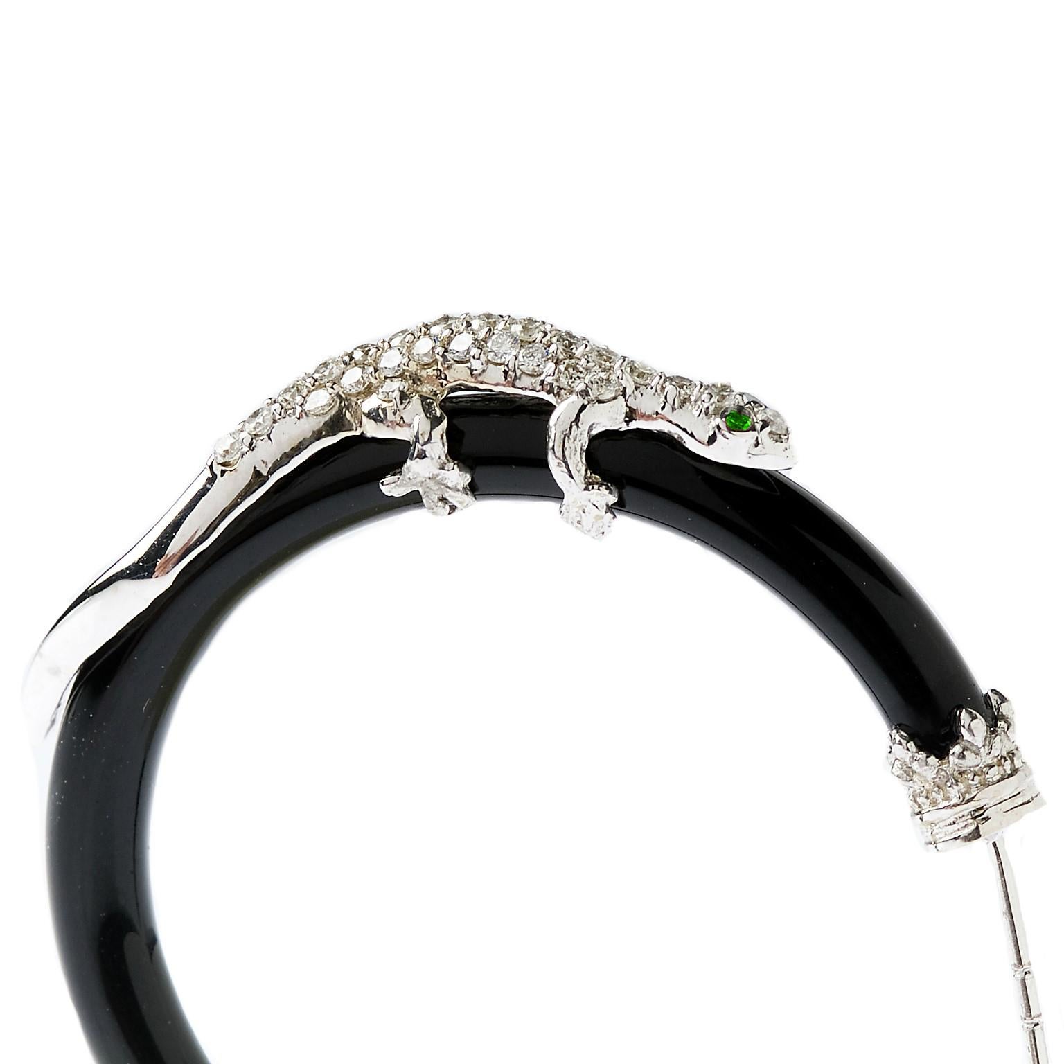 Stambolian 18K White Gold Diamond Black Onyx Tsavorite Lizard Hoop Earrings

These stunning earrings feature two lizards that sit ontop of Onyx hoops all done in diamonds. 

0.78 carat G color VS clarity white diamonds are set throughout the entire