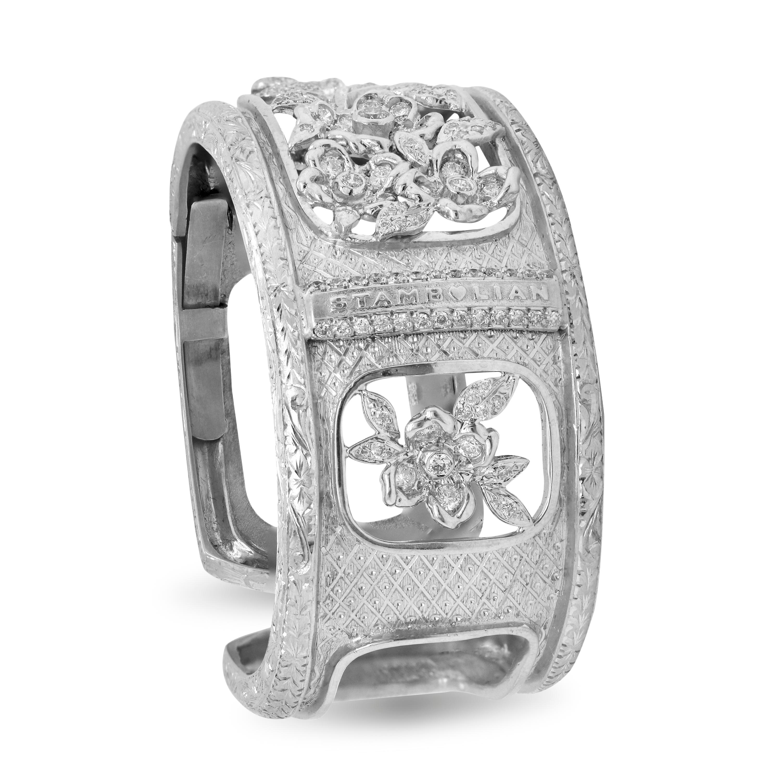 18K White Gold and Diamond Hand Engraved Floral Motif Wide Cuff Bracelet by Stambolian

This work of art is the only one of its kind. The floral motif in the center is set is with diamonds and the patterns all throughout the cuff are engraved by