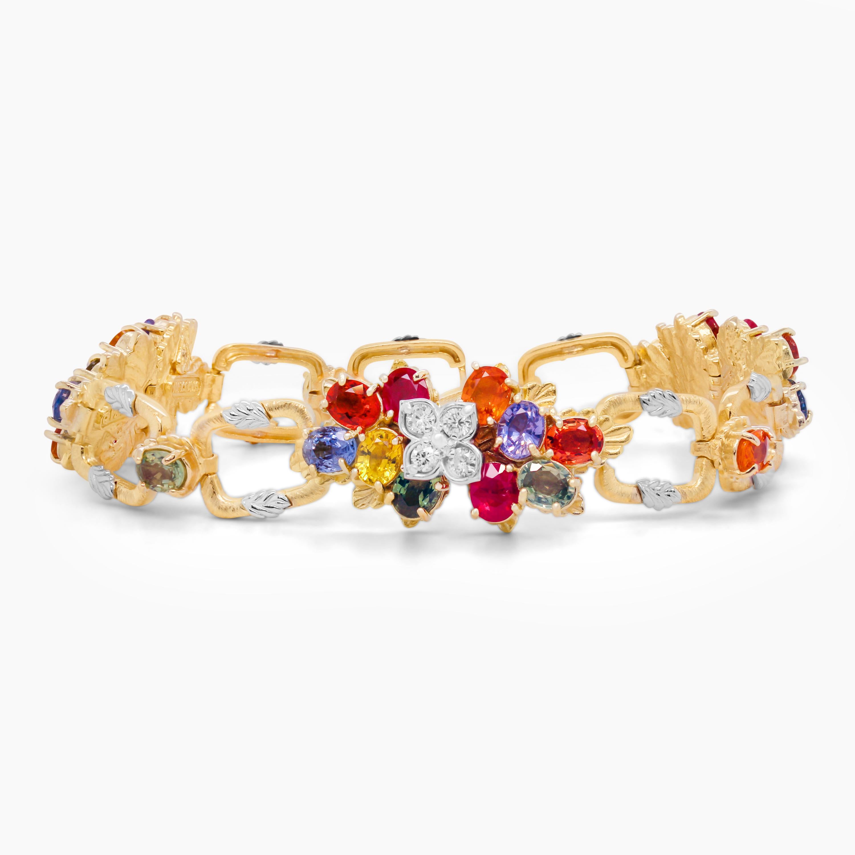 Stambolian 18K Yellow White Gold Multi Color Sapphire Ruby Floral Link Bracelet

This one-of-a-kind bracelet features yellow gold links with white gold leaves on each square. Three sections of multi-color sapphires make up this bracelet with diamond