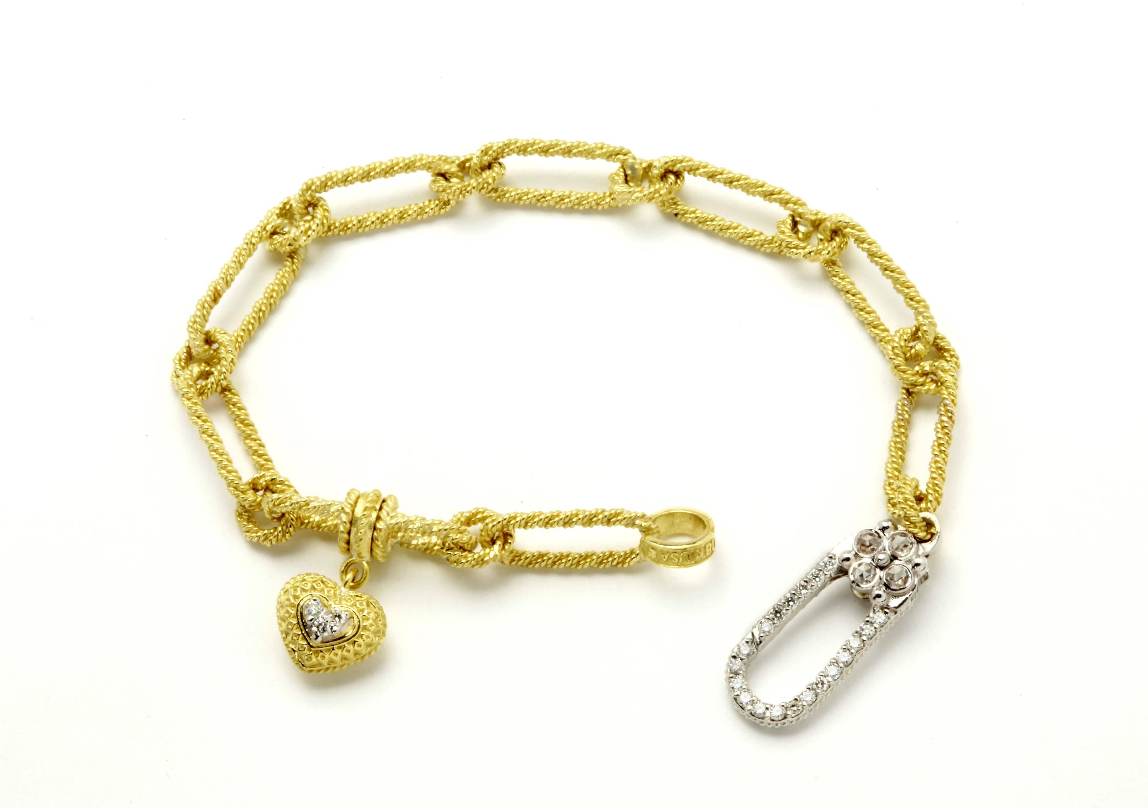 IF YOU ARE REALLY INTERESTED, CONTACT US WITH ANY REASONABLE OFFER. WE WILL TRY OUR BEST TO MAKE YOU HAPPY!

18K Yellow Gold Bracelet with diamonds and dangling heart

Diamonds cover both sides of clasp and on heart

Double sided clasp has 0.16ct.