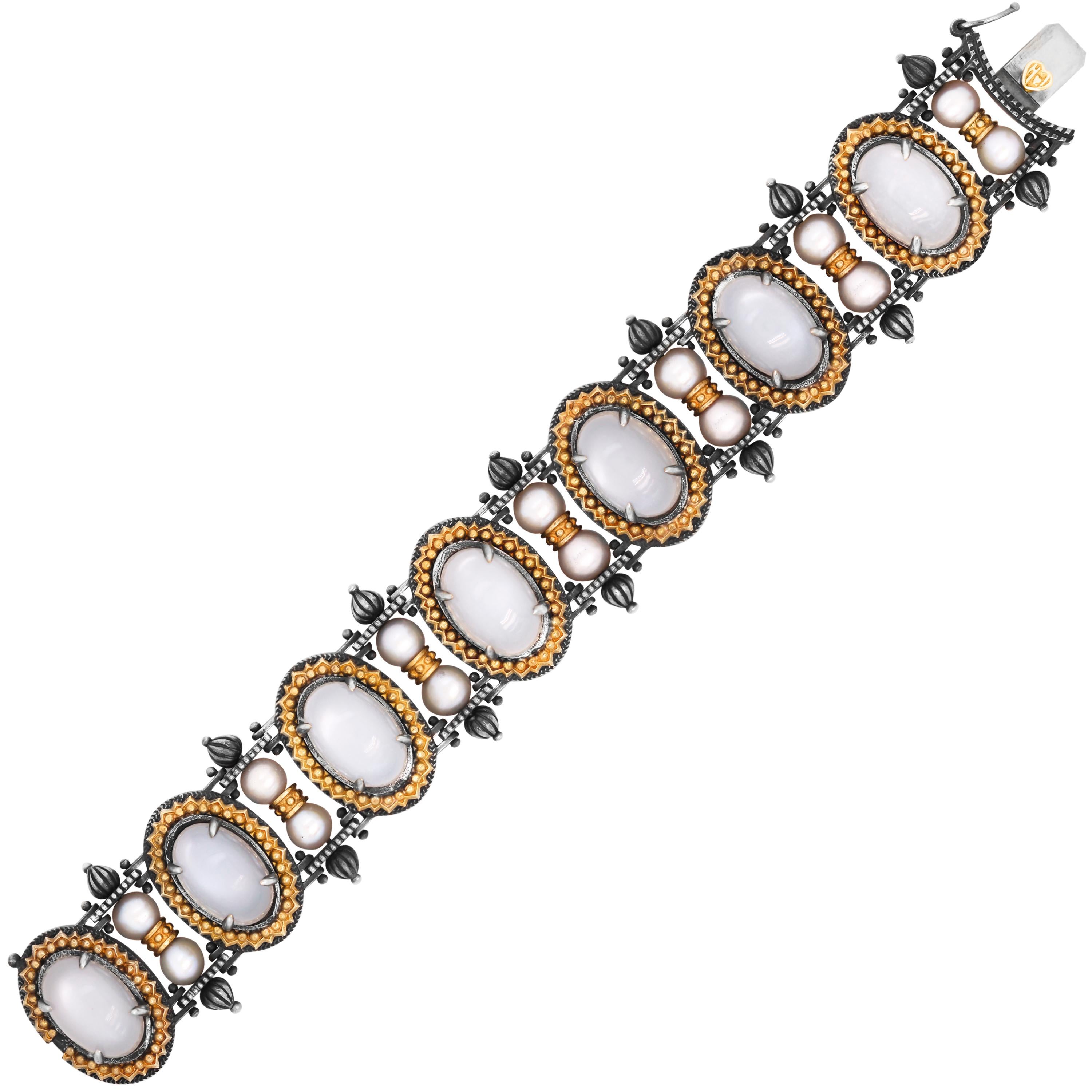 Stambolian Oval Grey Moonstone Round Pearl Aged Silver 18K Gold Retro Bracelet

From the Beginnings collection by Stambolian. This bracelet features Grey moonstones with two pearls in between each section

Apprx. 53 carat Grey moonstones

7 inches