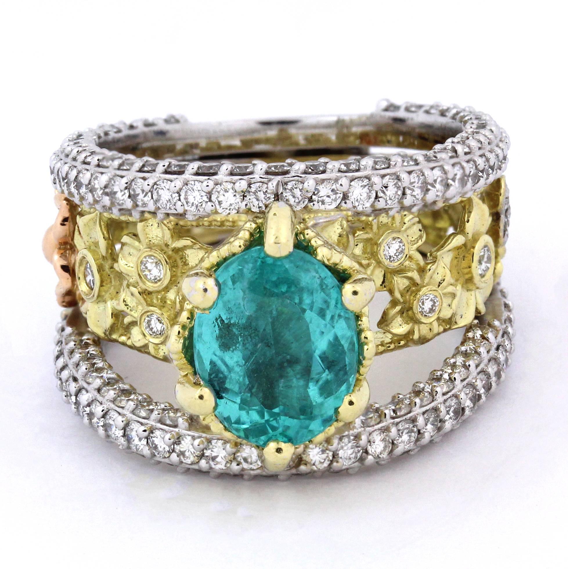18K Yellow, White and Pink Gold Ring with Paraiba Copper Bearing Tourmaline ring by Stambolian

This is a one of a kind ring with a stunning display of design work and craftsmanship. The ring itself has three sections. One done in yellow gold with