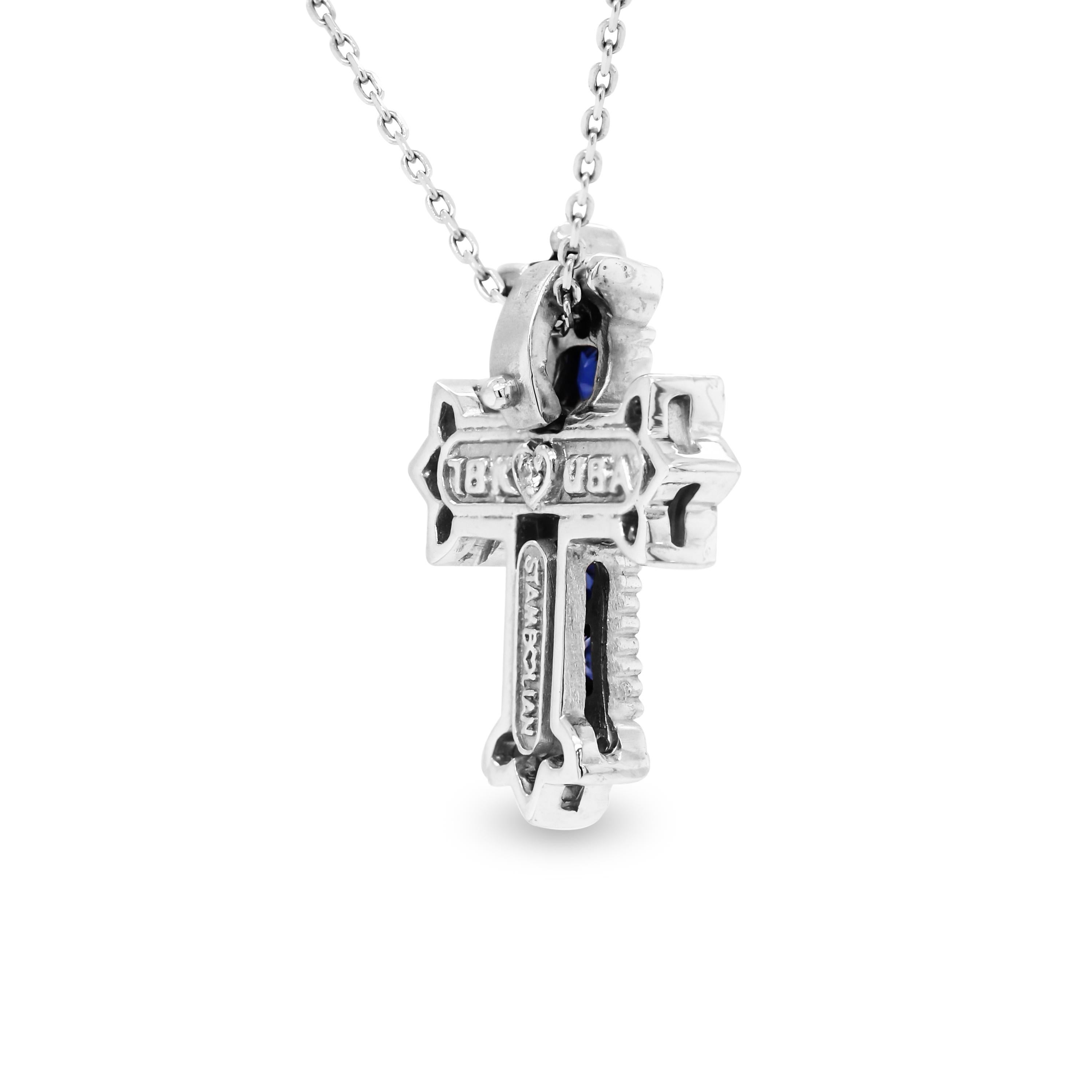 Stambolian Princess Cut Blue Sapphires Diamond 18K White Gold Cross Pendant Necklace

0.27 carat G color, VS clarity diamonds total weight.  
1.50 carat Princess Cut, Blue Sapphires total weight.

Cross is 0.80 inch in length from top to bottom.