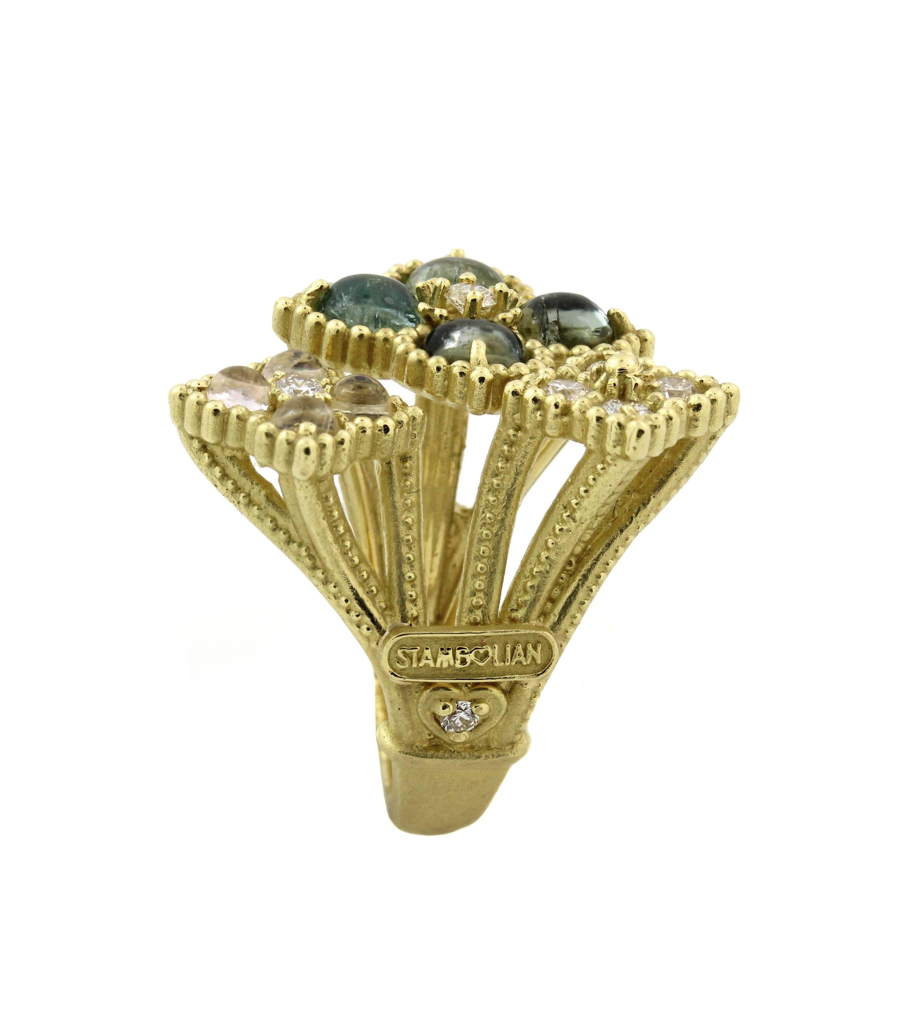 18K Yellow Gold Ring with Tourmalines, Rainbow Moonstones and Diamonds

Apprx. 2.50ct. Tourmalines are set next to eachother on the largest section of ring with diamond center. A slightly smaller section has 4 rainbow moonstones. The third section