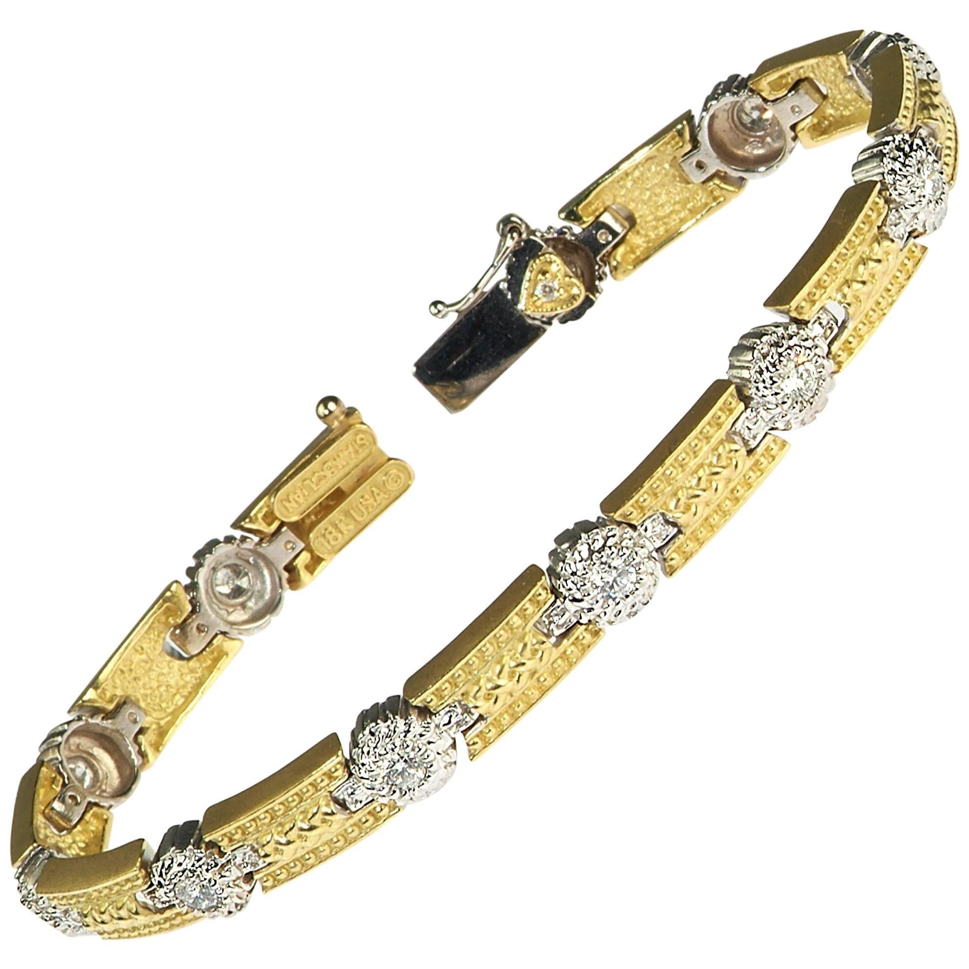 18K Yellow and White Two-Tone Gold Tennis Bracelet with Bezel Set Diamonds by Stambolian

This unique style tennis bracelet features bezel-set diamonds in white gold with yellow gold connections.

1.10 carat G Color, VS Clarity diamonds

Tongue