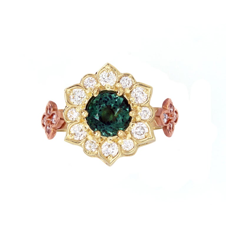 18K Yellow and Rose Gold Two-Tone Gold Ring with Diamonds and Mint Green Tourmaline Center by Stambolian

This is a one-of-a-kind ring with a very unique color Tourmaline center. We have never seen a tourmaline in this shade of green.

Tourmaline is