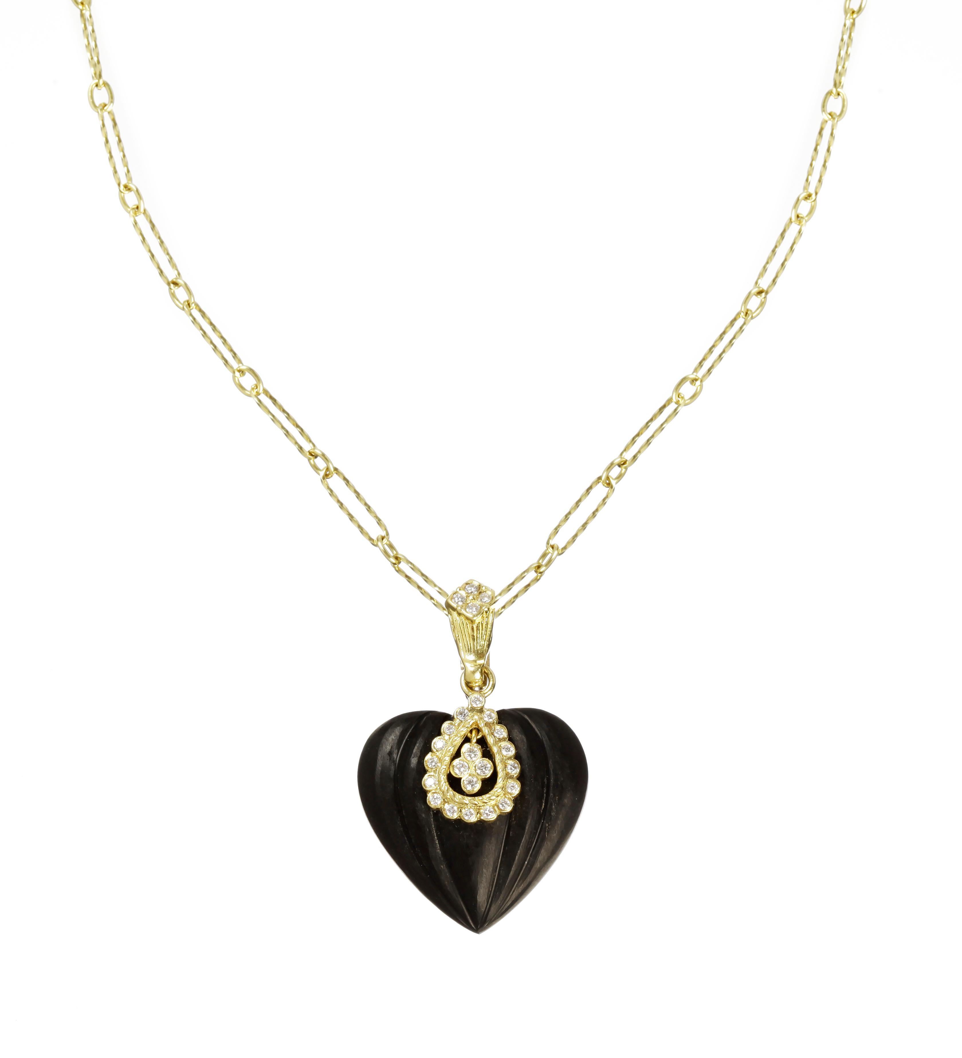 IF YOU ARE REALLY INTERESTED, CONTACT US WITH ANY REASONABLE OFFER. WE WILL TRY OUR BEST TO MAKE YOU HAPPY!

18K Yellow Gold and Diamond Frosted Onyx Heart Enhancer Pendant with Chain

Special-cut, frosted black onyx pendant has diamonds in the