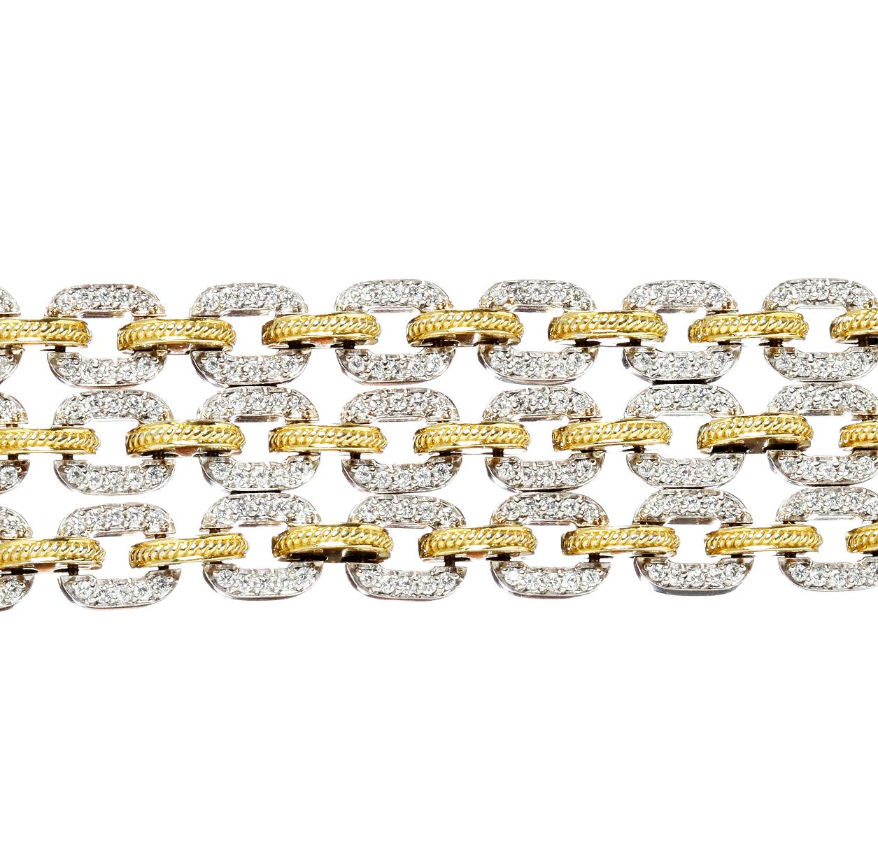 Stambolian 18 Karat Yellow White Two-Tone Gold and Diamond Three Link Bracelet

This stunning bracelet features 5.02 carat G color VS clarity diamonds all throughout

Bracelet is 7 inches in length and uses the push-button tongue clasp

Signed