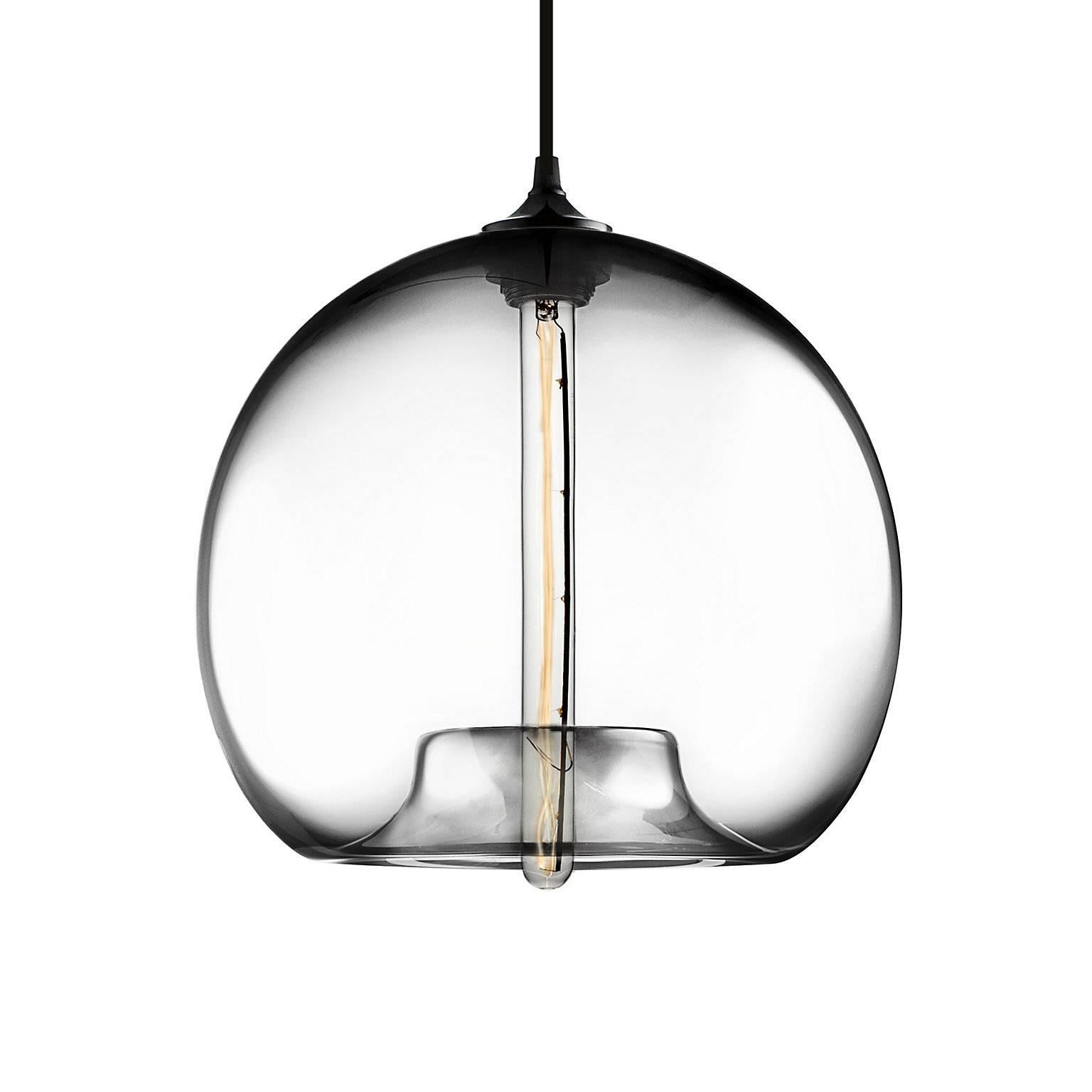 The first design that inspired Niche, the Stamen pendant boasts a voluptuous body that tucks into itself unexpectedly. Every single glass pendant light that comes from Niche is handblown by real human beings in a state-of-the-art studio located in