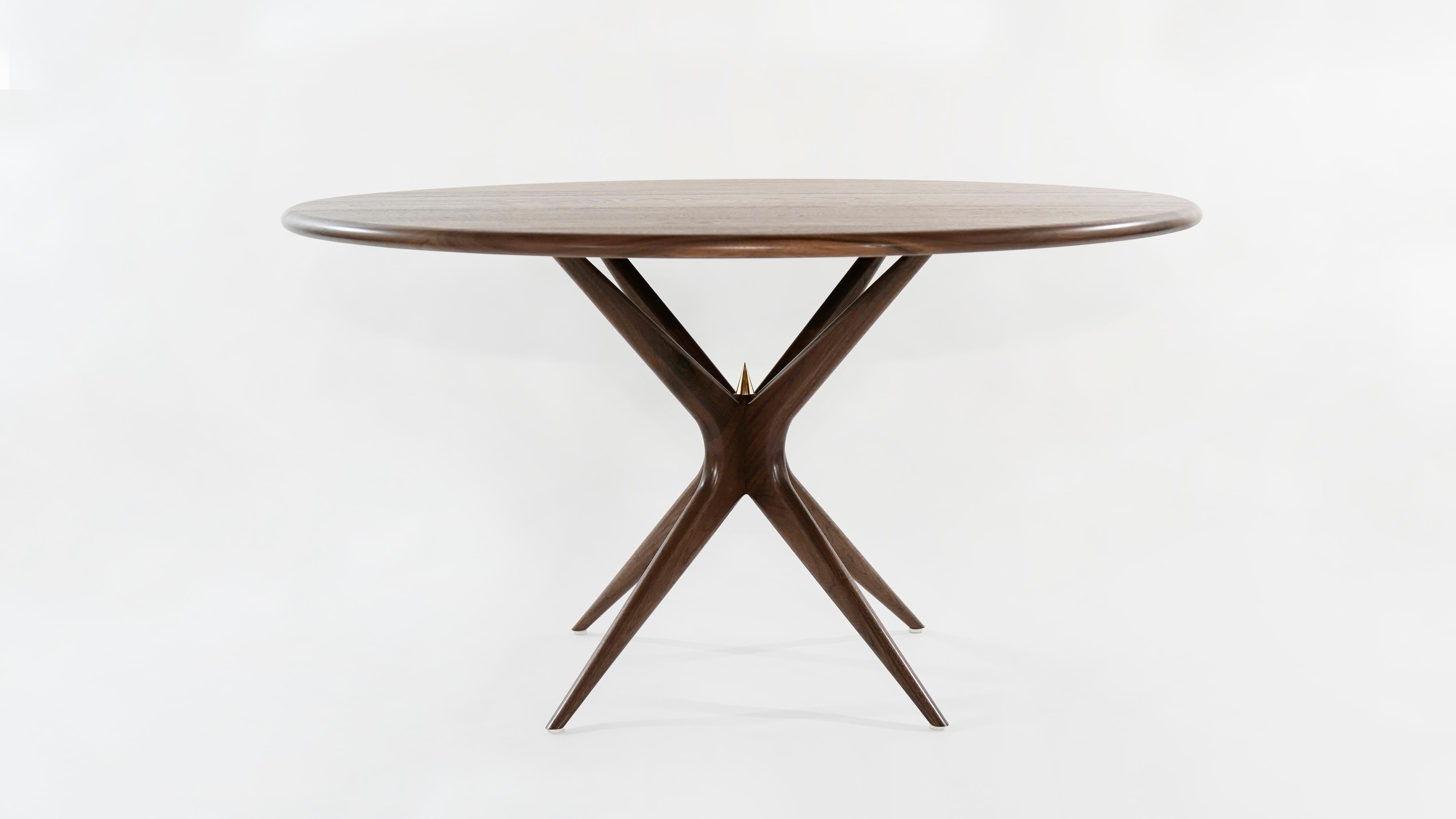 Introducing The Gazelle Dining Table by Carlos Solano, a captivating addition to Stamford Modern's expanding collection of Mid-Century inspired, fully customizable furniture. This exquisite table effortlessly marries demure curves with unexpected