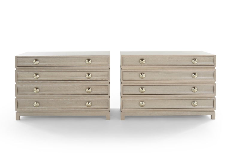 Stacked with confidence and lots of character. This set of two commodes pays homage to designer Paul Frankl with a rustic modern finish. Each drawer front is beautifully carved with curved edges that mirror its large, shaped brass pulls. The dresser