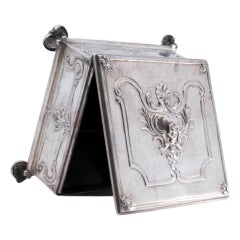 Stamp box in embossed silver w/ wooden interior
five compartments, hinged lid