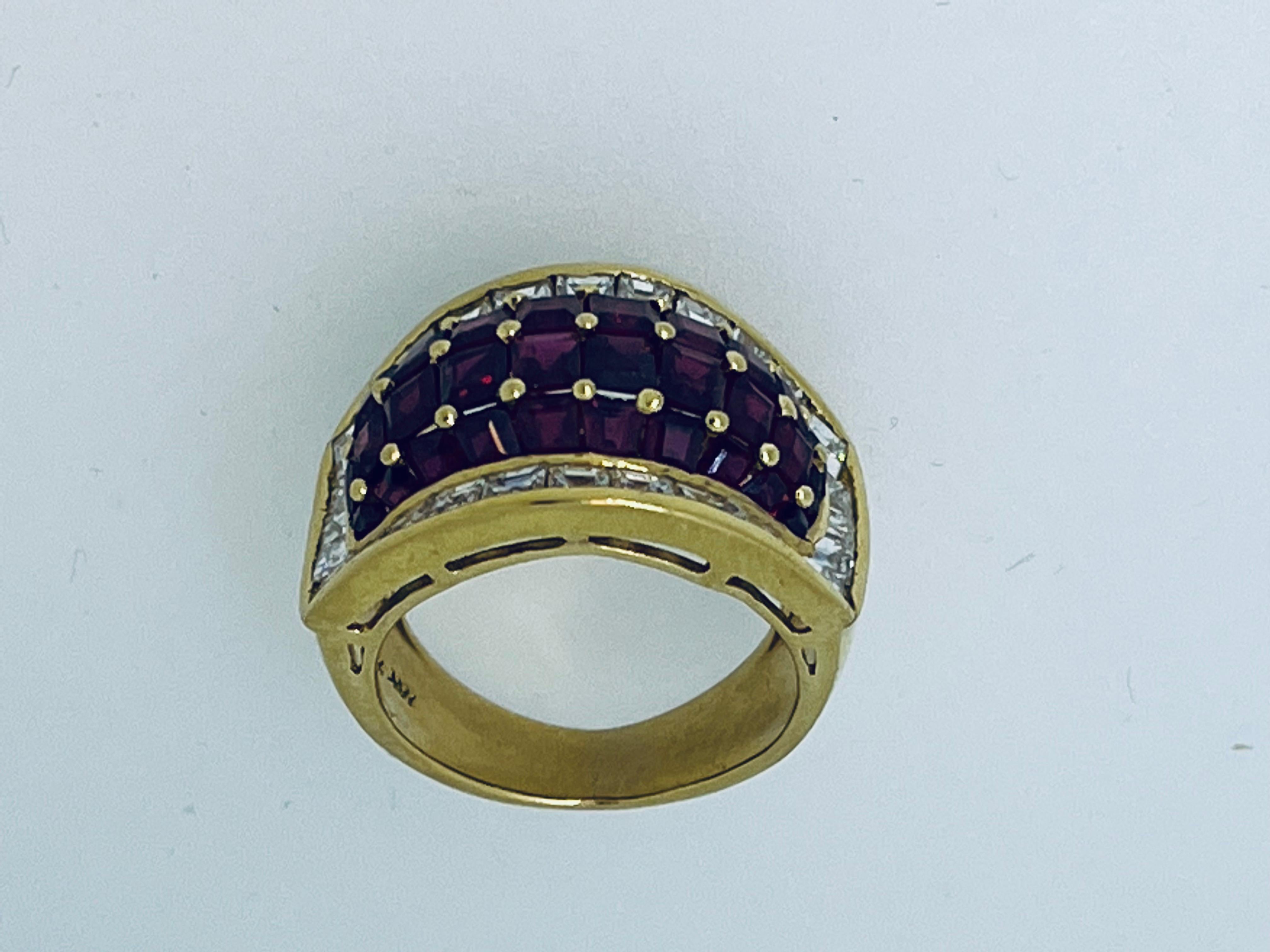 The central domed section set with square cut rubies surrounded by square cut diamonds. Diamond weight approximately 1.40ct. Ruby weight approximately 5ct. Weight: 9.7 grammes. Italian manufacture, circa 1990. Ring is resizable. Size is: K1/4 (UK),