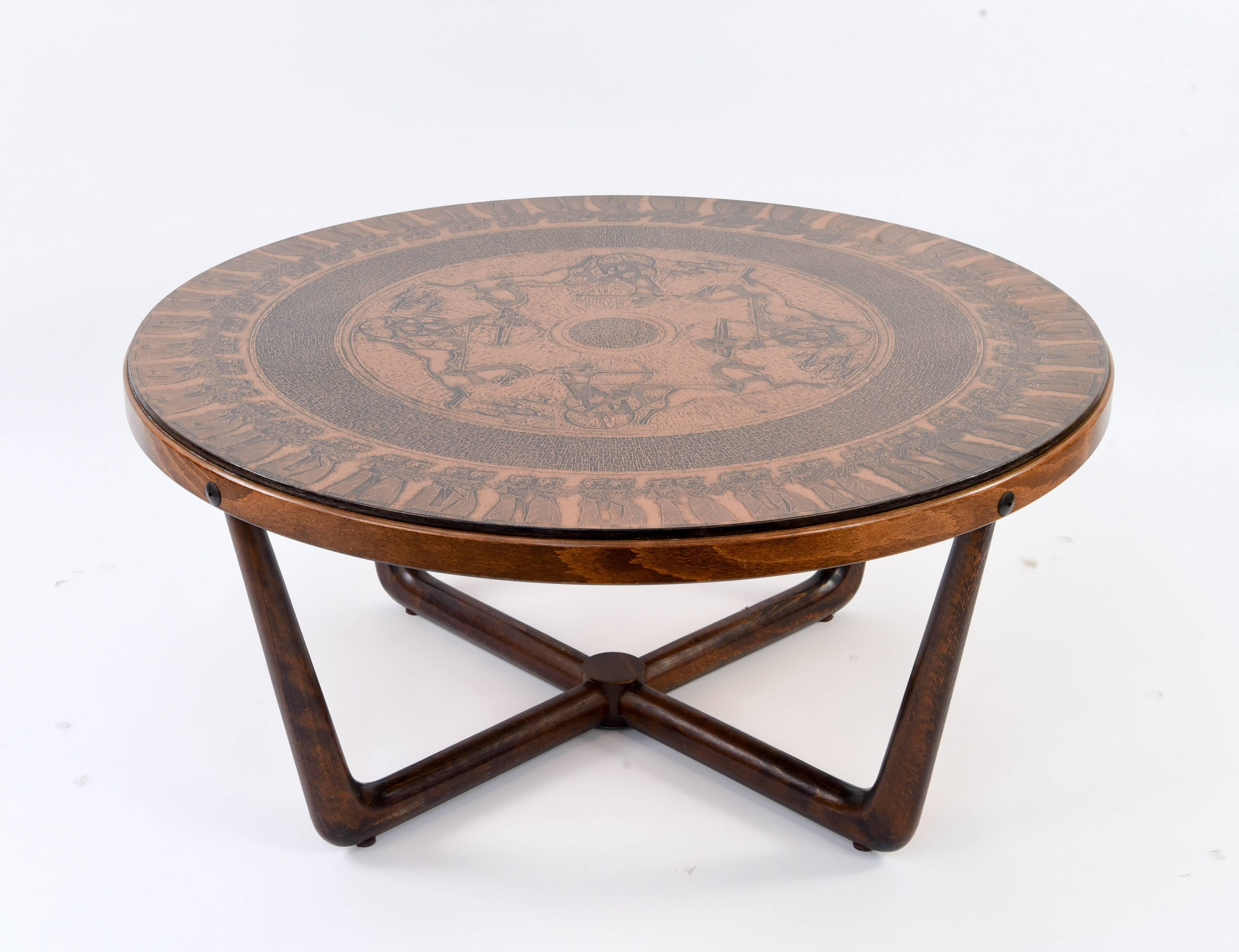 This coffee table features a stamped copper top in neo-Egyptian themes. Crafted by Vad Trevare Fabric Norge, circa 1970. Base in solid, stained beechwood.