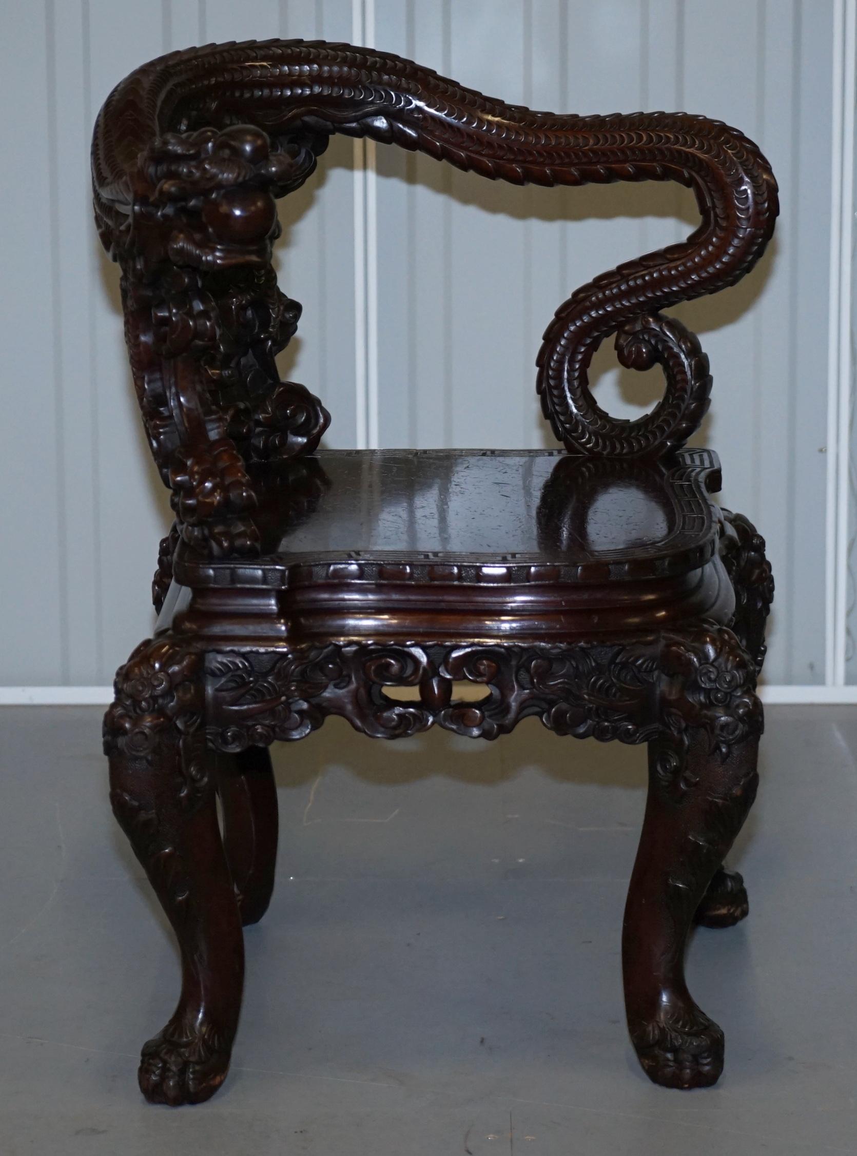 We are delighted to offer for sale this stunning original Japanese Export circa 1880 hand carved Hardwood corner chair with oversized curled Dragon back rest

A very good looking well made and decorative armchair, these come up for sale regularly