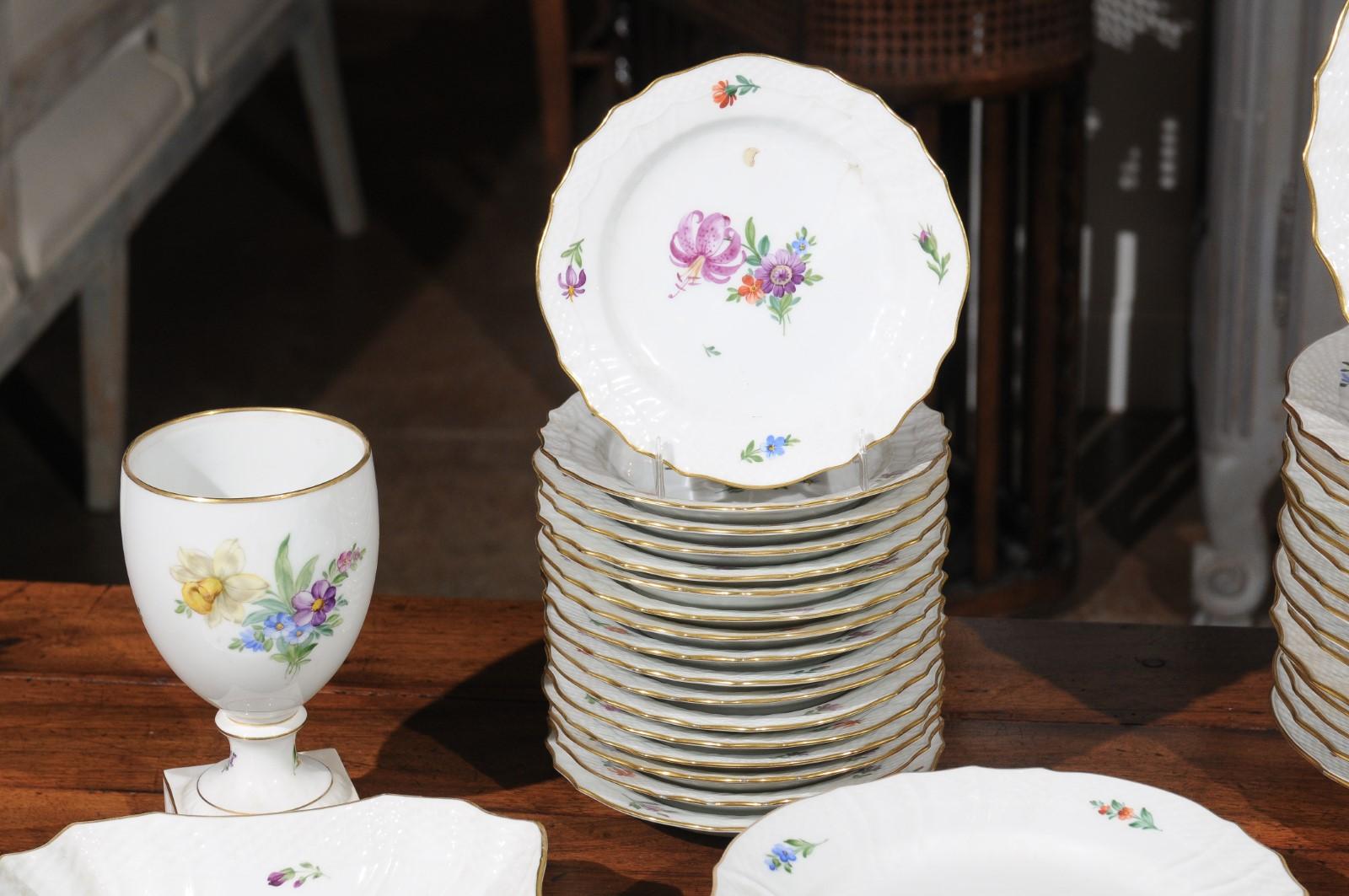 Porcelain Stamped Royal Copenhagen China Set with Hand Painted Floral Décor and Gilt Trim