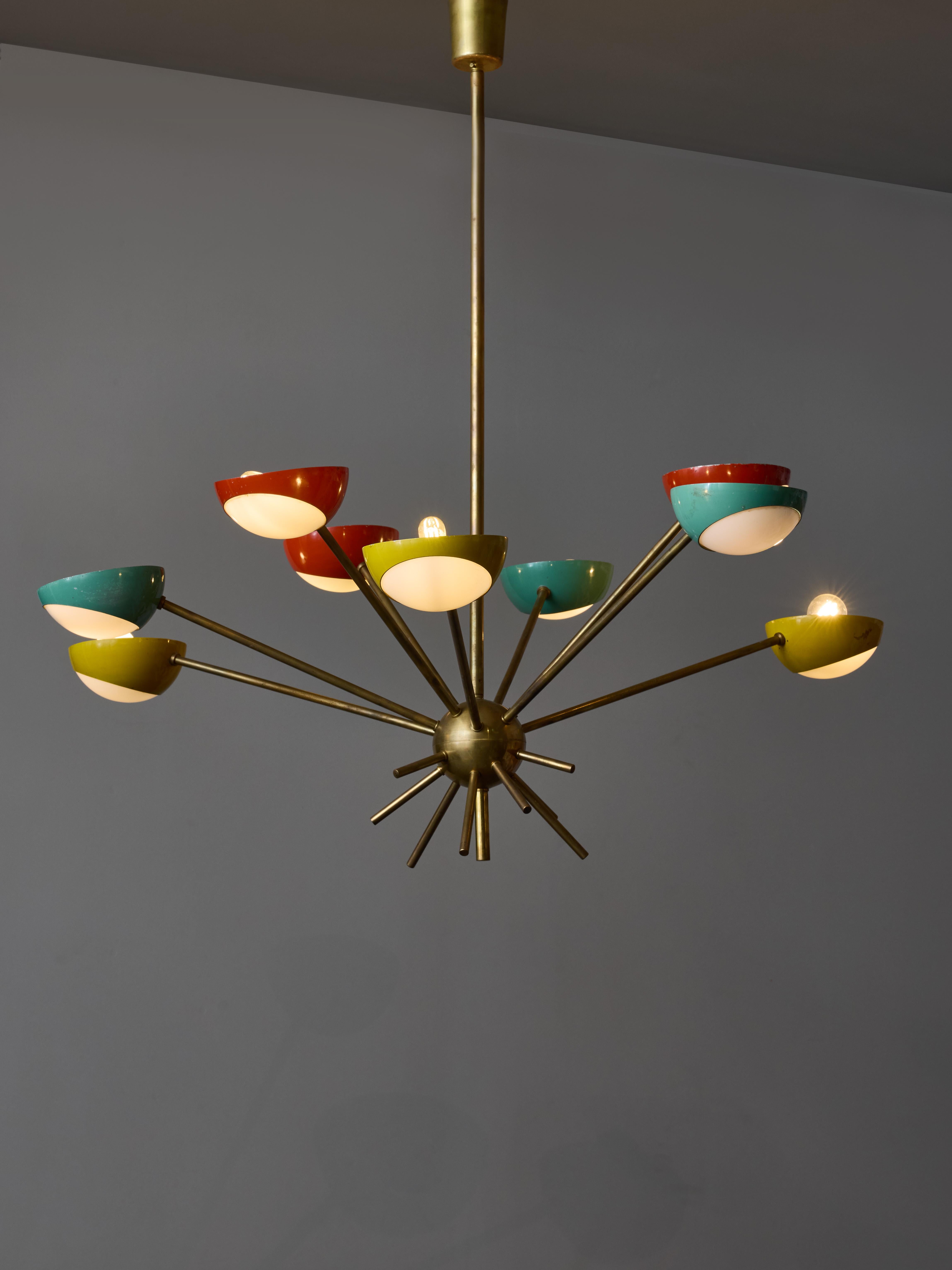 1950s chandelier made by Stilnovo, made of nine arms of light pointing upward, at different angles and lengths. The arms end with enameled colourful cups holding opaline glass curved diffusers.

Original stamp on the stem