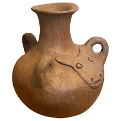 Stamped vintage primitive ceramic pottery Vase with Animal head motif.