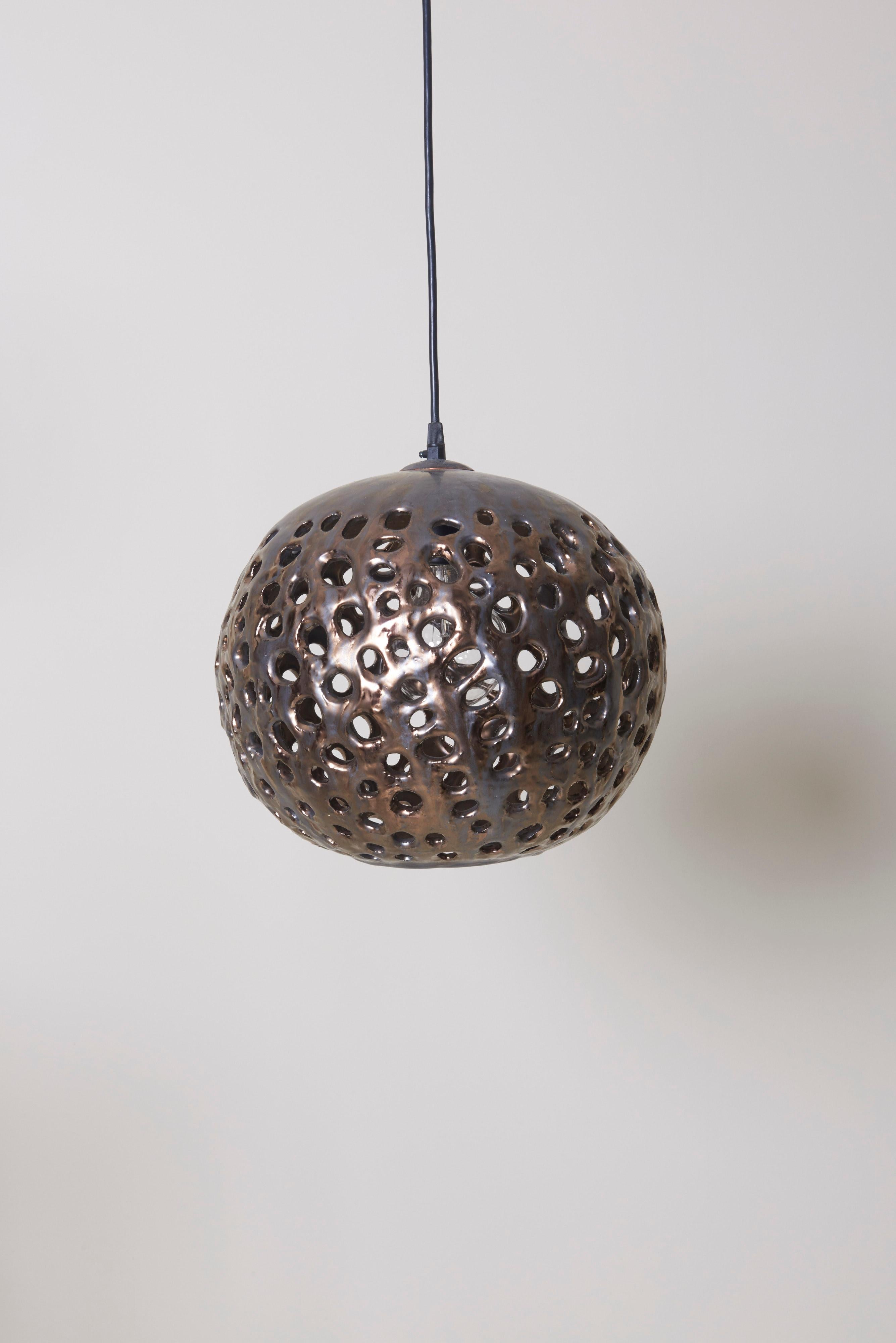 This ball lamp in spray metal is handmade by Stan Bitters. Warm light soaks through the different openings.
One Model A / E27 Bulb 40 watts.
To be on the safe side, the lamp should be checked locally by a specialist concerning local requirements.


 