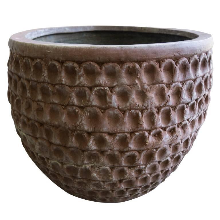 This Stan Bitters thumb pot features a rarely seen Stan Bitters Clovis California stamp on the inside and was once a part of the artists own collection. The rim on the top and the unusually thick texture of the thumb imprints make this planter stand