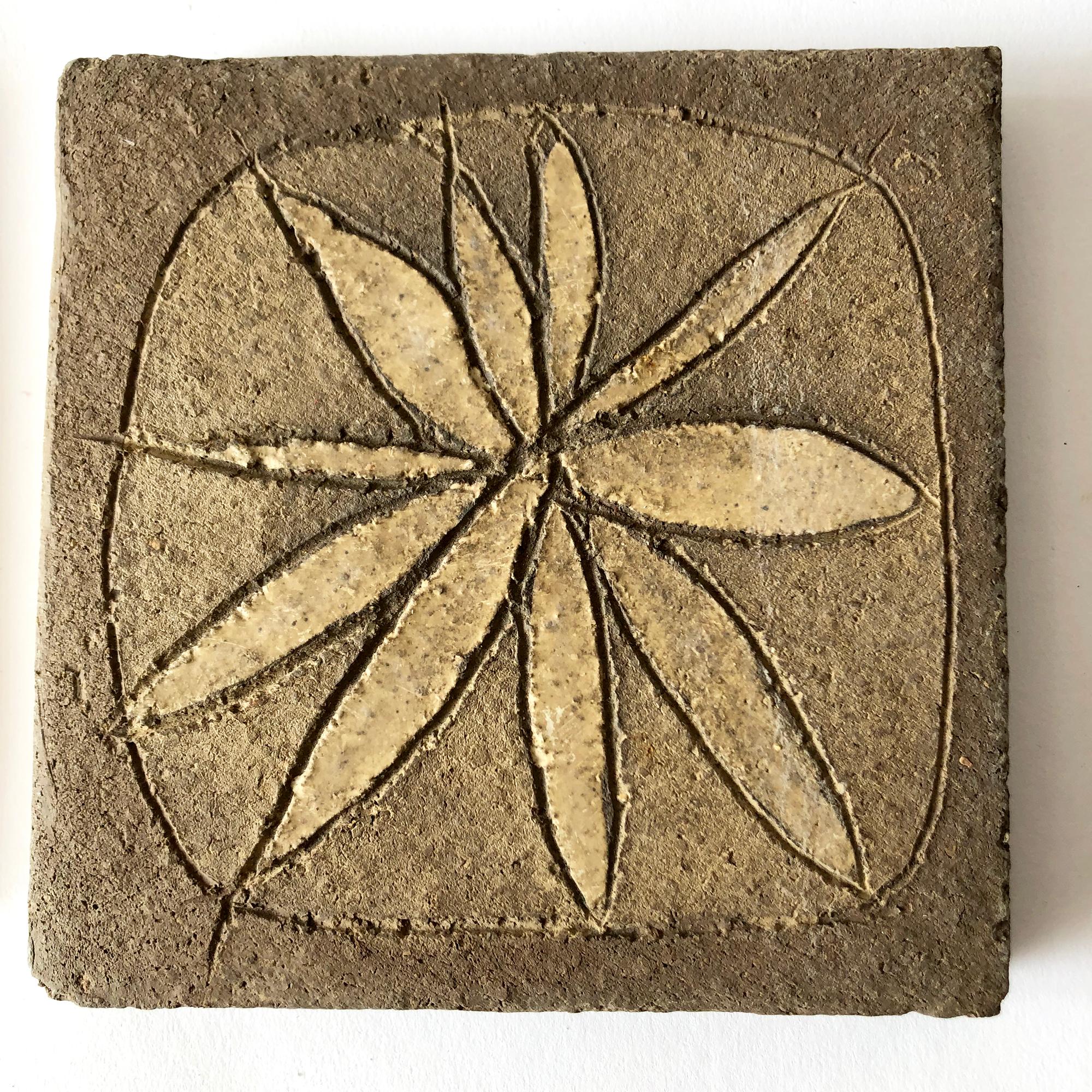 Set of four stoneware tiles with sgraffito flower design created by Stan Bitters for Hans Sumph. Tiles measure approximately 5.75