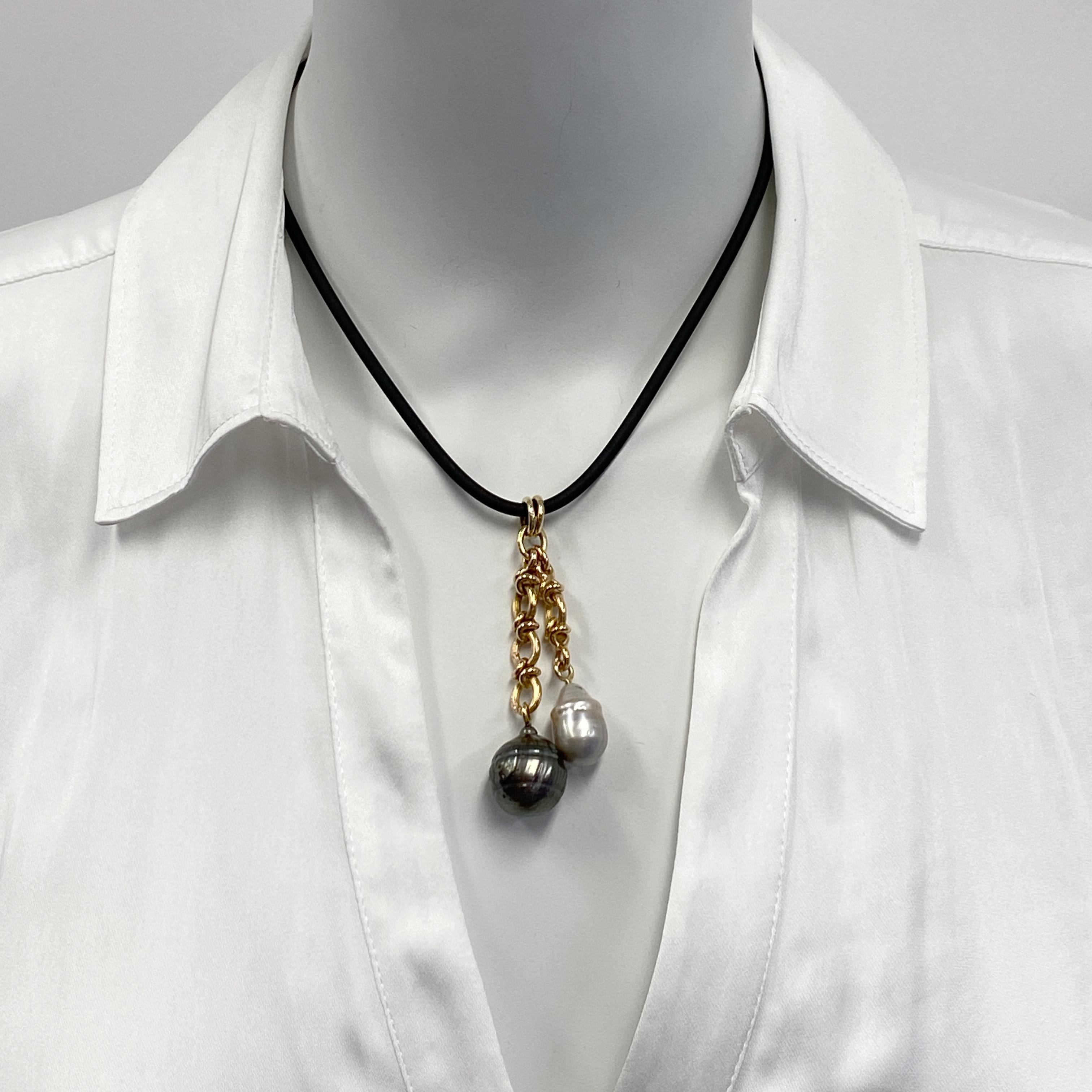 Two luscious and idiosyncratic baroque pearls hang from gorgeous links of 18 karat chain to make this one-of-a-kind pendant by Eytan Brandes.

Both of the pearls are unusual and both are from our pearl dealer, George Hajjar of Seven Seas Pearls. 