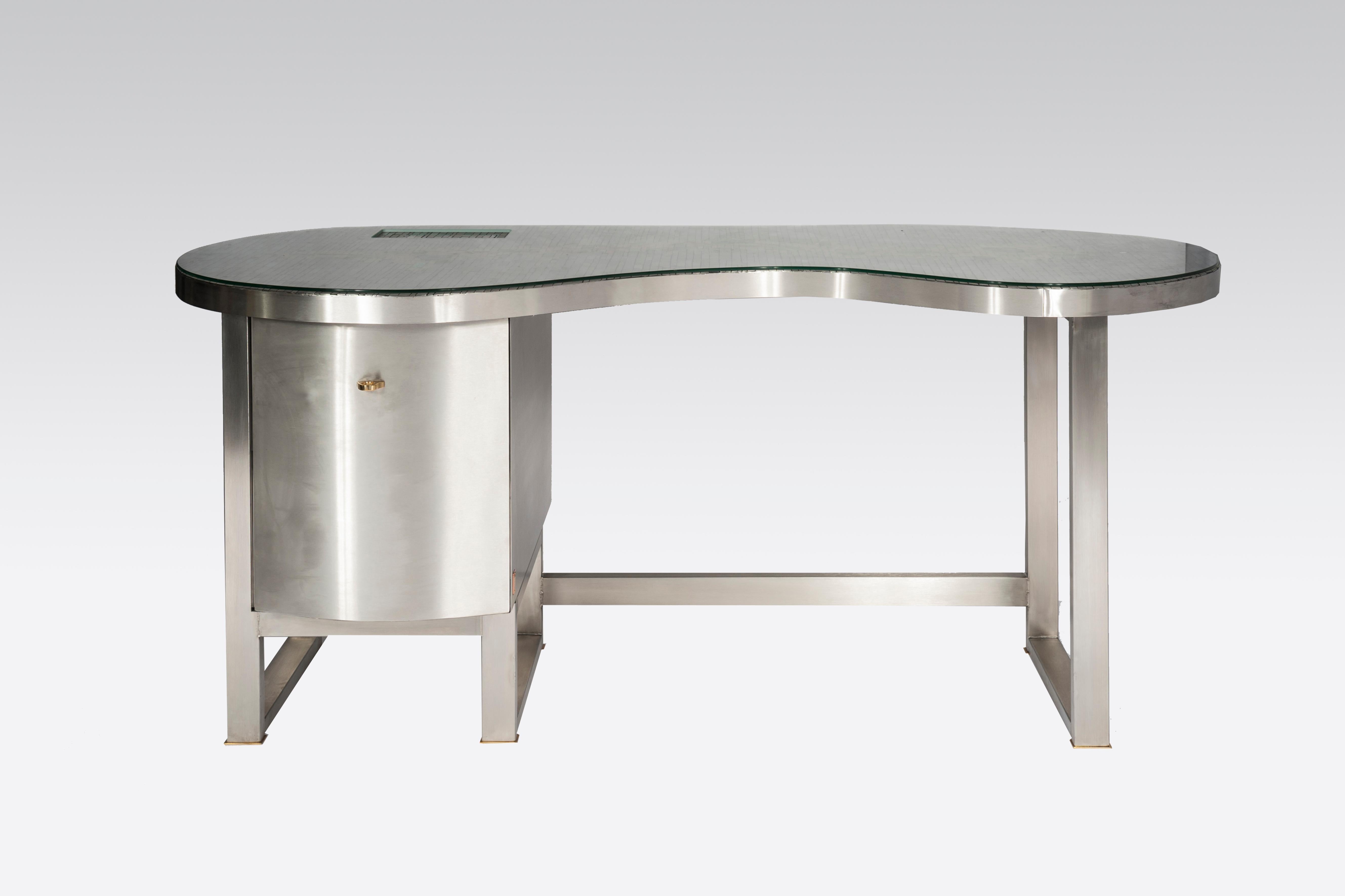 Created to measure by Stan Usel, this desk of stainless steel, red copper and brass is inserted with a magnificent malachite and agates stones highlighting a mosaic radiation. Each piece is topped with unique stones and is discretly designed to