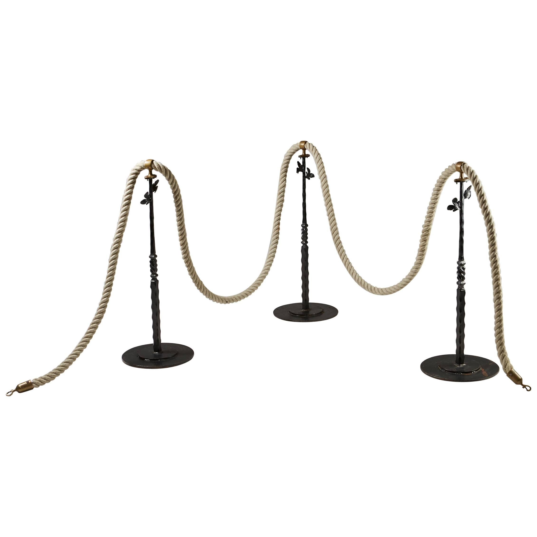 Stanchions with rope, anonymous, 
Sweden, 1900s. 
Brass, lacquered metal and rope.

Measures: Height of poles: 91 cm/ 3' 1/4