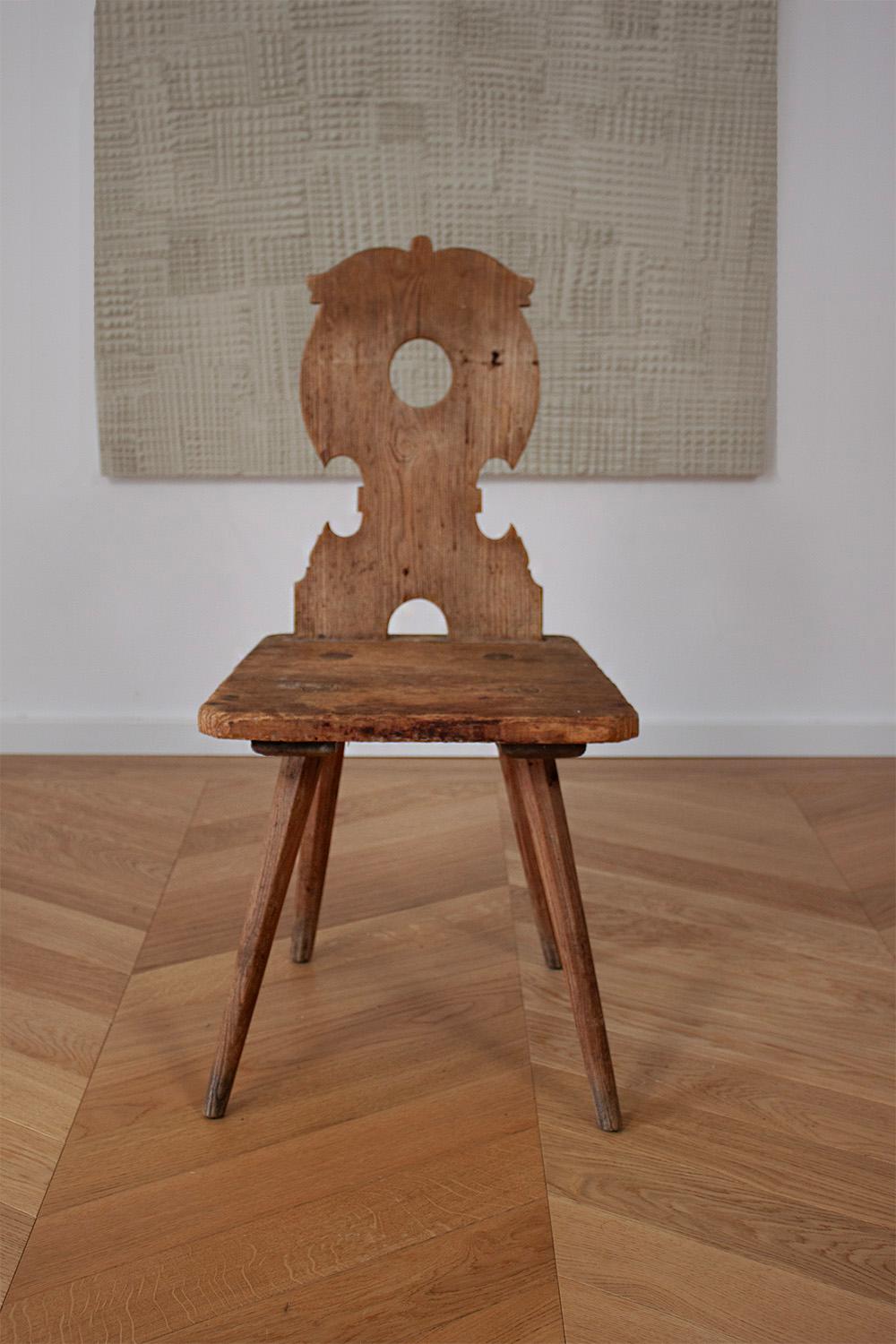 This beautiful old German Stabelle is a typical farmers' chair from the turn of the century. 
The chair is primitivly made with no glue or nails. The construction is based on an interlocking system. 
The tradition behind these chairs are that during