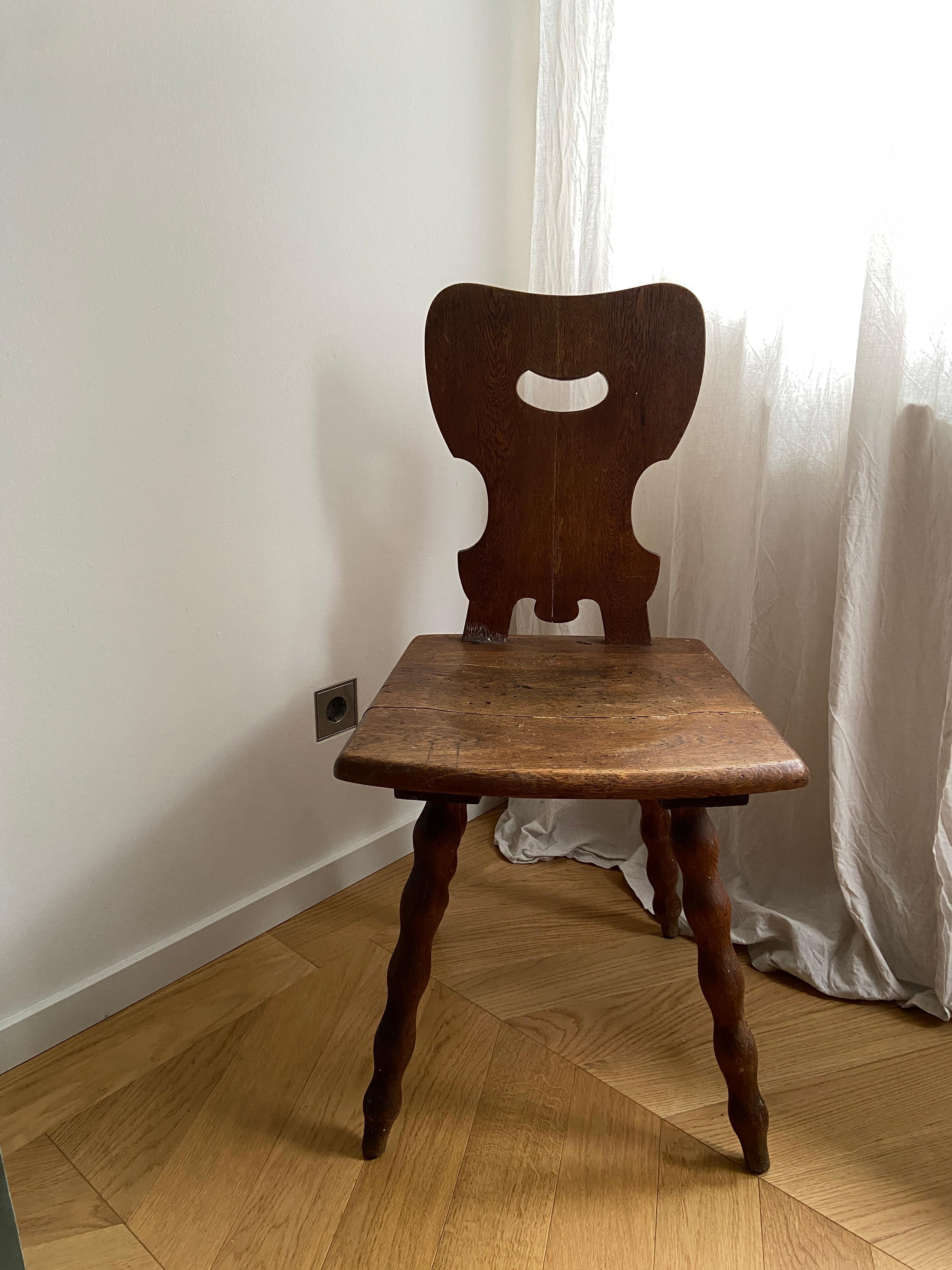 This beautiful old German Stabelle is a typical farmers' chair.
This chair has unique bobbin legs.
The chair is primitivly made. The construction is based on an interlocking system. 
The tradition behind these chairs are that during the colder