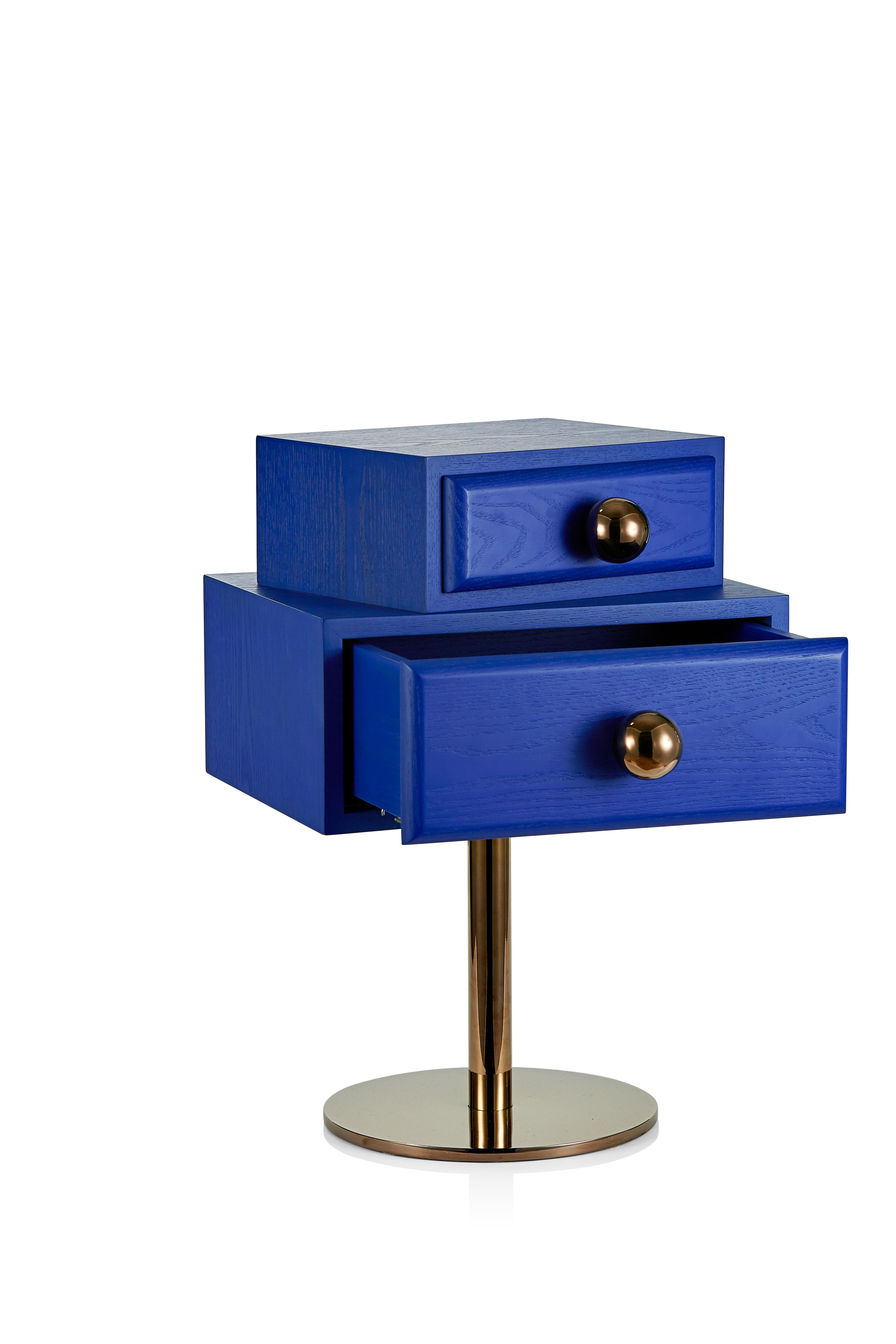Stand by me side table by Thomas Dariel
Dimensions: D 36.6 x W 38 x H 55 cm 
Materials: Two versions: Left, Right Structure in MDF with painted ash veneer Metal base plated with glossy Pink Copper finish Handle knob in plated metal with glossy